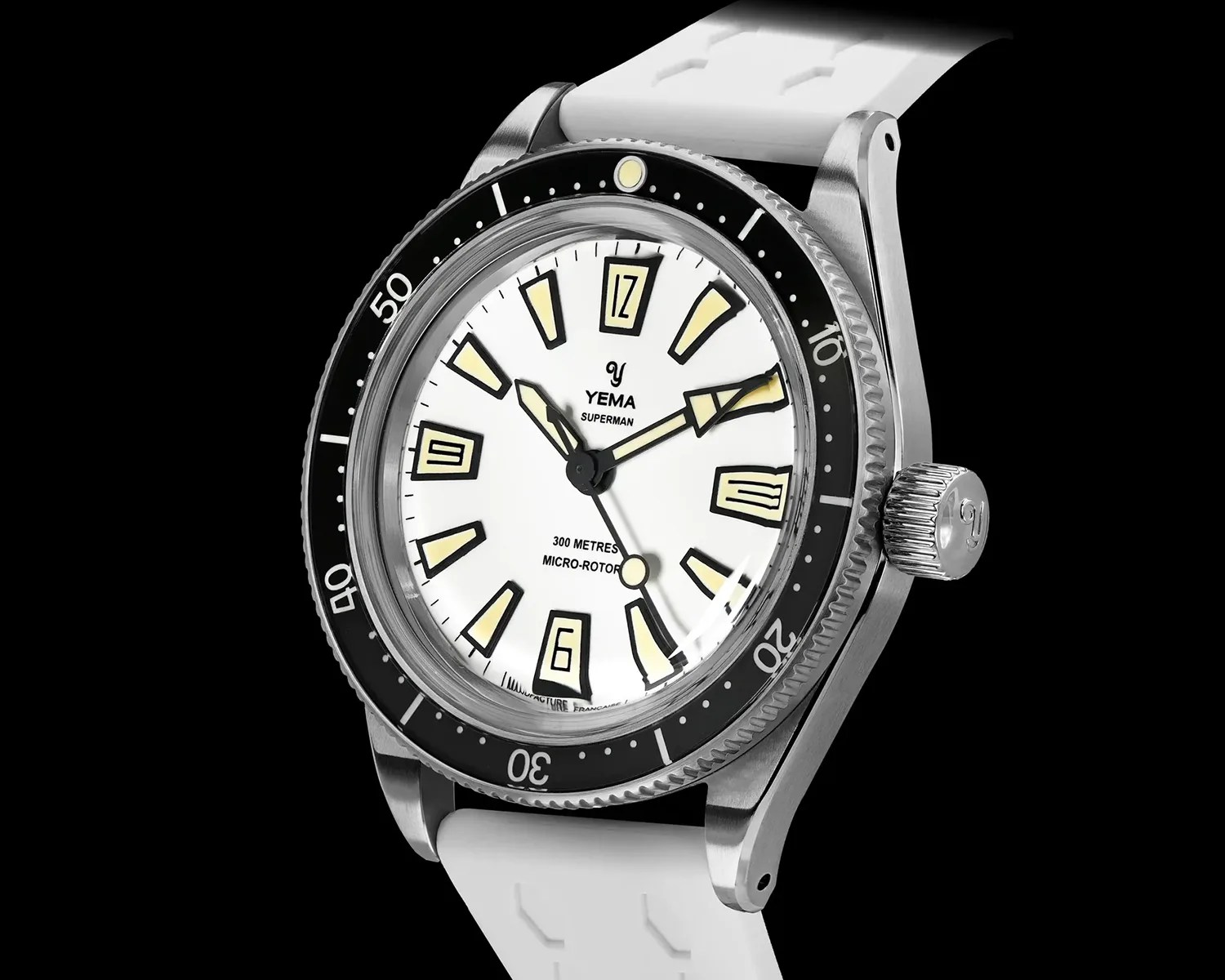 Yema Superman dive watch with white dial, black bezel, luminous markers, and white rubber strap.