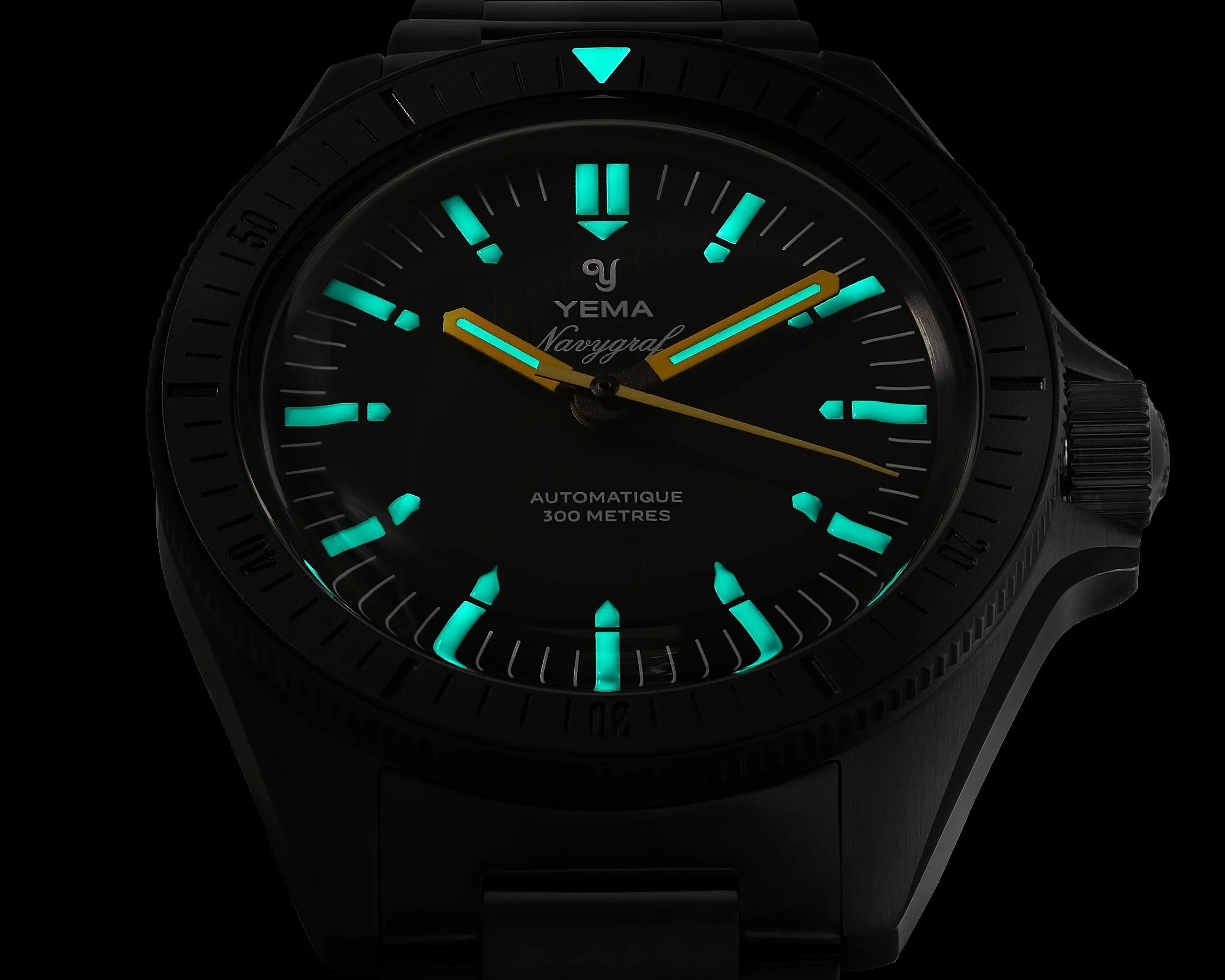 Black Yema Navygraf watch face with glowing turquoise hour markers and hands, yellow second hand, and 300 meters water resistance text.