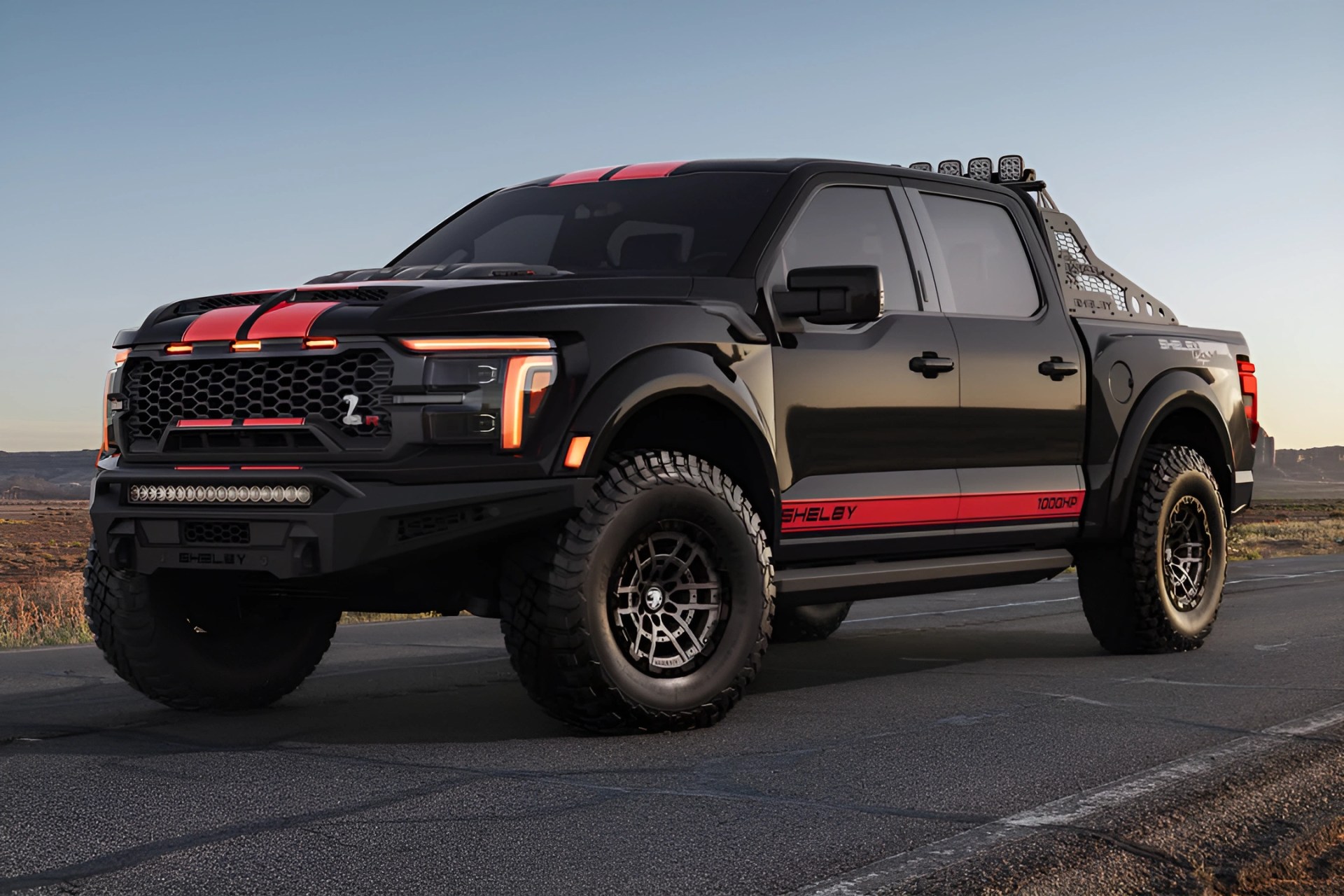 Black Shelby pickup truck with red racing stripes and off-road tires parked on a road at sunset.