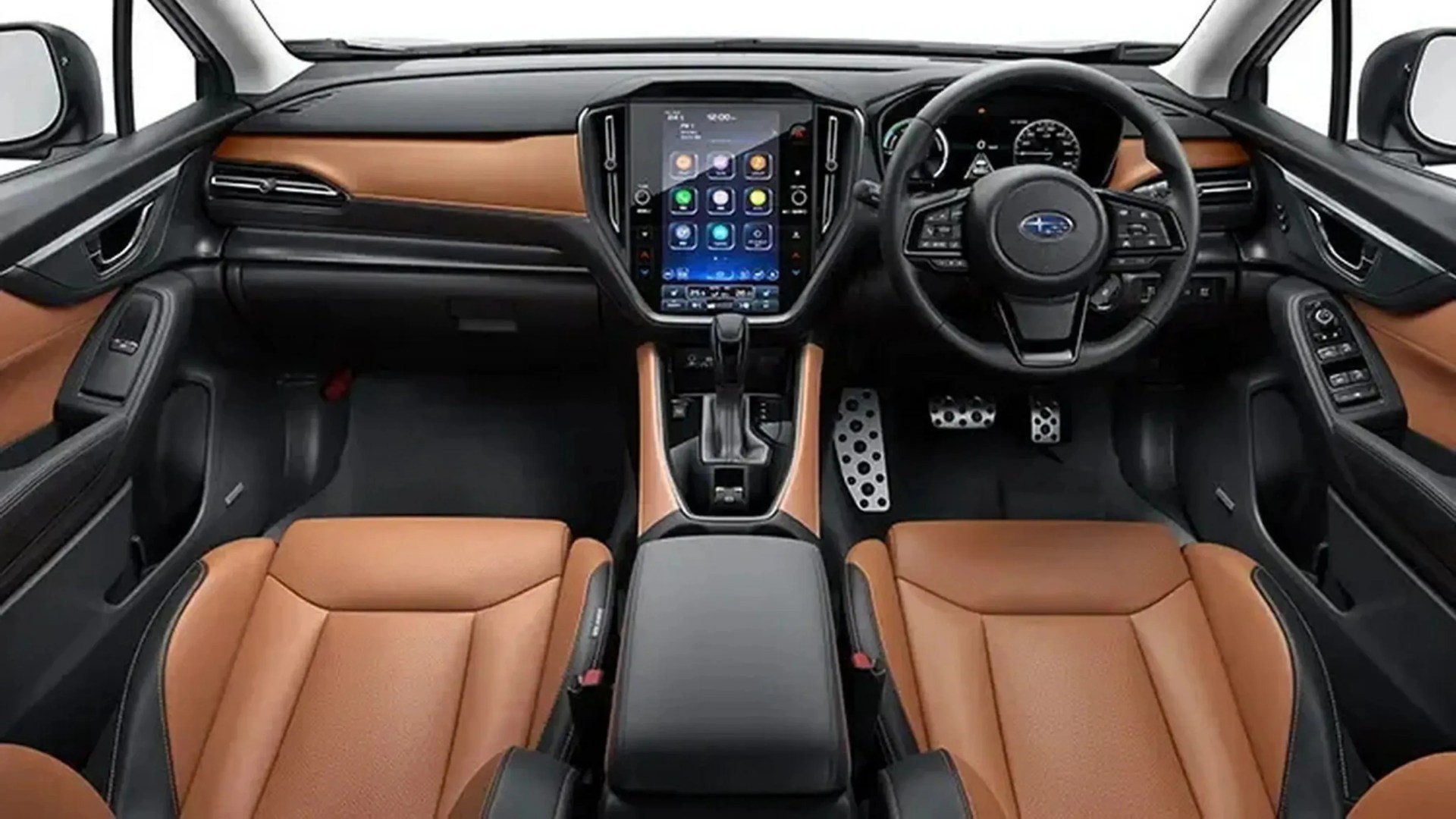 Car interior with tan leather seats, black dashboard, central touchscreen, and right-hand steering wheel with Subaru logo.