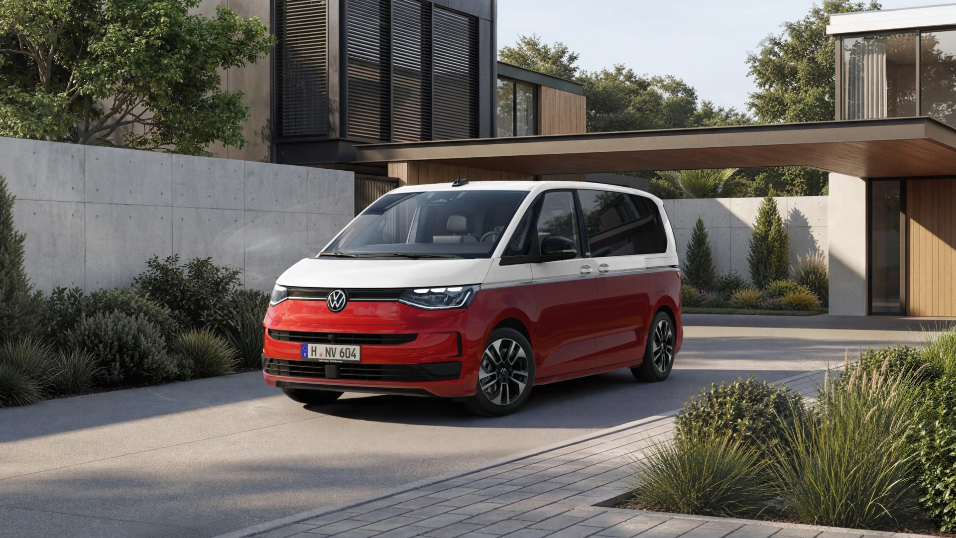 Red and white Volkswagen van parked in front of a modern house with concrete and wood exterior.