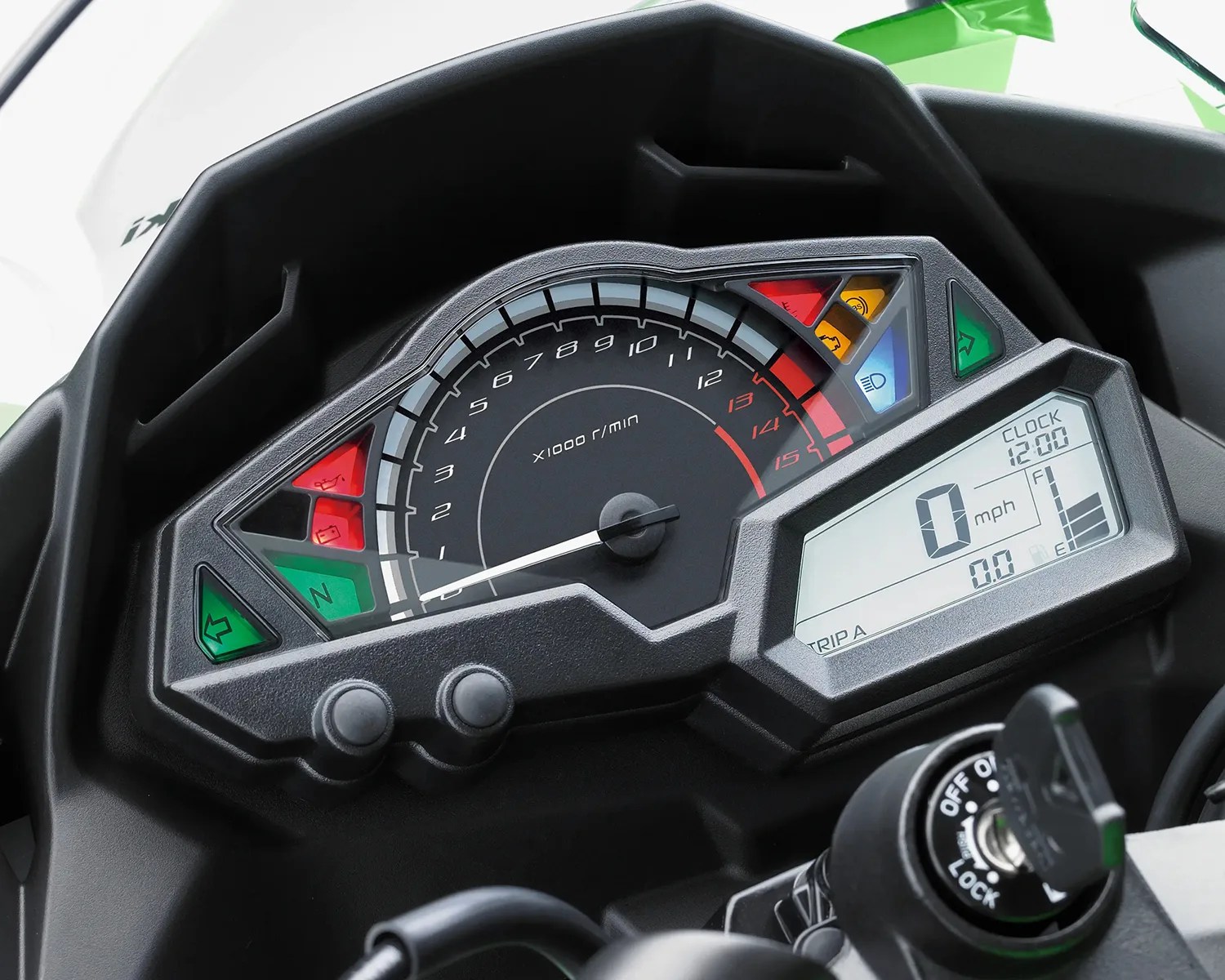 Motorcycle dashboard with analog tachometer, digital speedometer, fuel gauge, and ignition key in lock position.