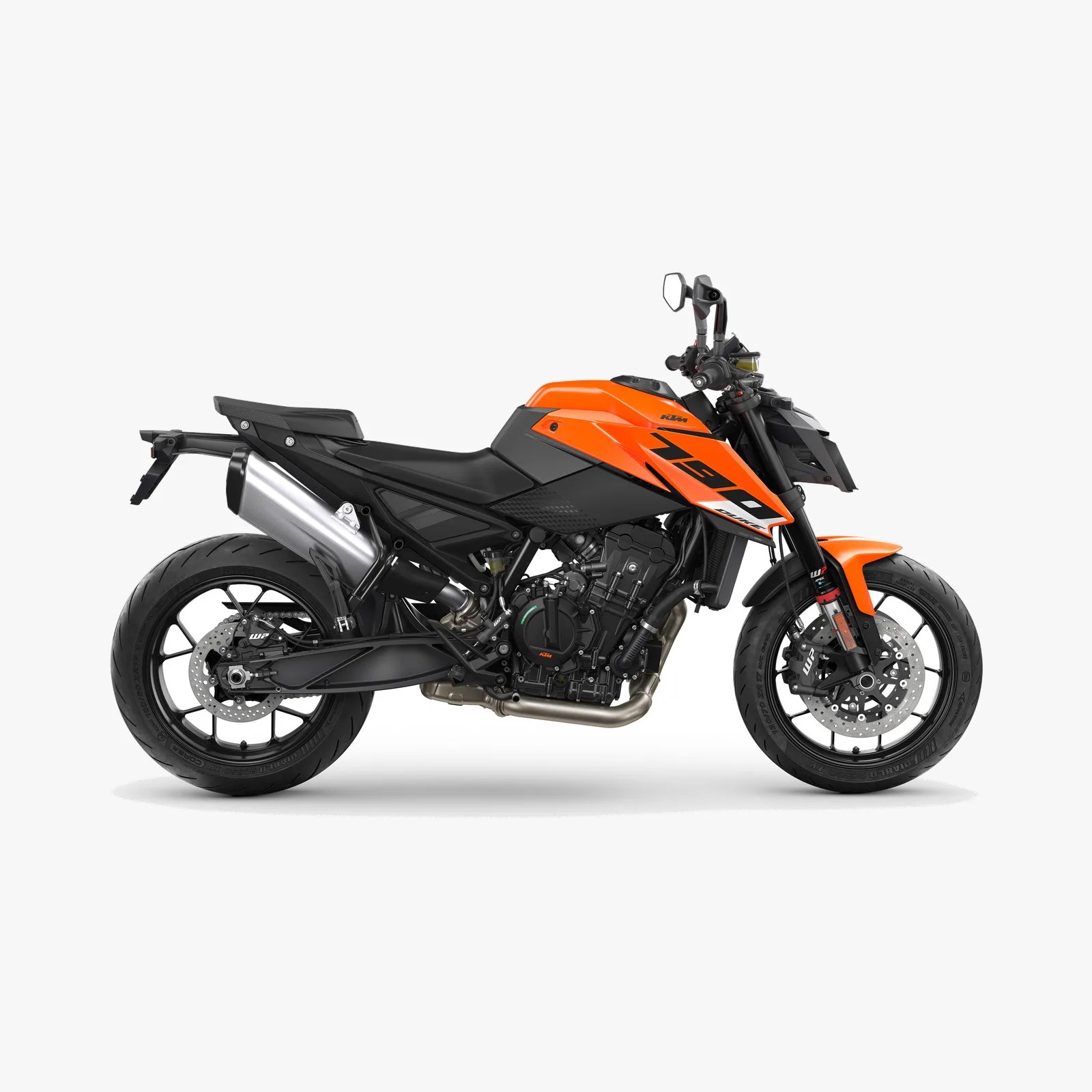 Orange and black KTM 790 Duke motorcycle with exposed engine and dual disc brakes on white background.