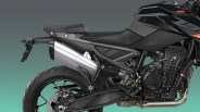 Close-up of the rear and middle section of a black KTM motorcycle showing the exhaust, seat, rear wheel, and engine components.