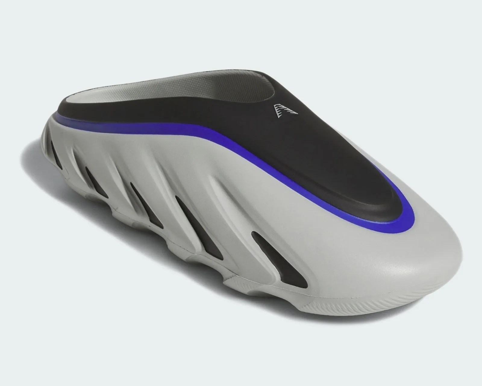 Slip-on shoe with a black upper, gray sole with cutout details, and a blue accent stripe.