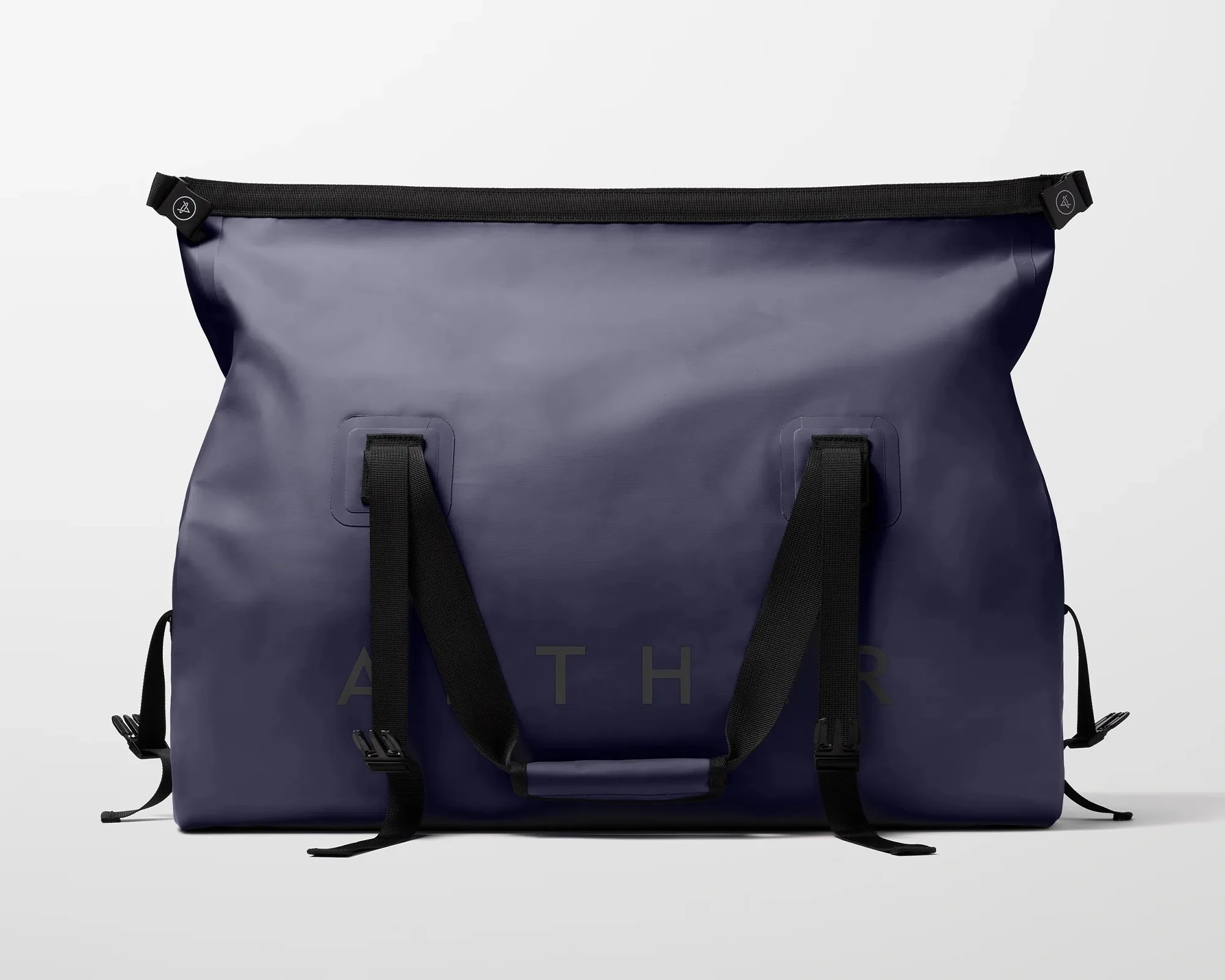 Navy blue waterproof duffel bag with black adjustable straps and buckles on a white background.