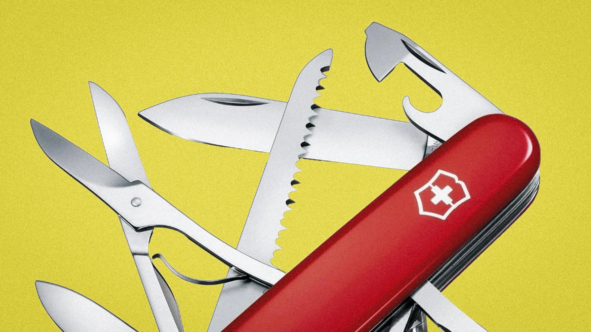 Red Swiss Army knife with multiple stainless steel tools extended against a yellow background.