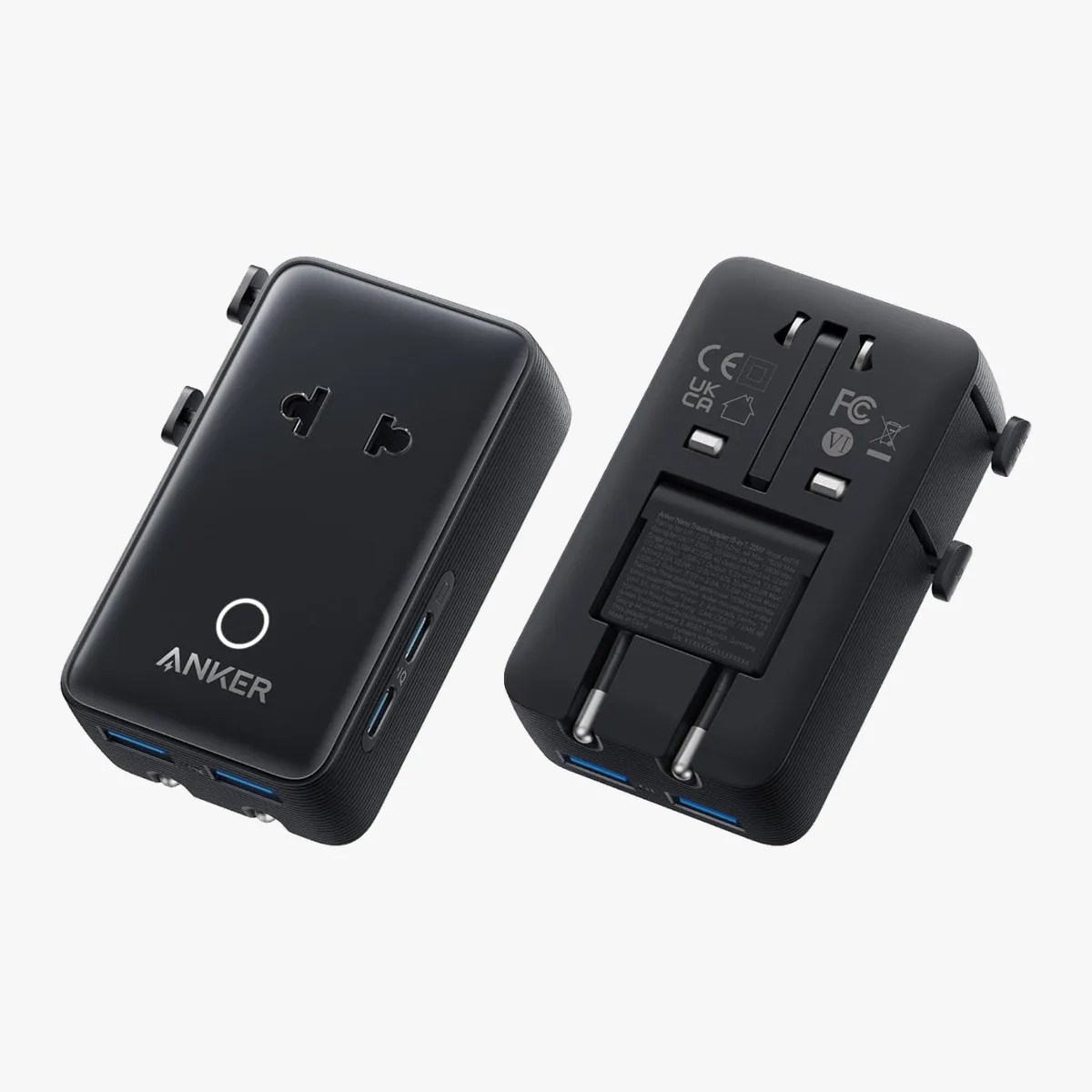 Two black Anker travel adapters with multiple plug types and USB ports shown from front and back.
