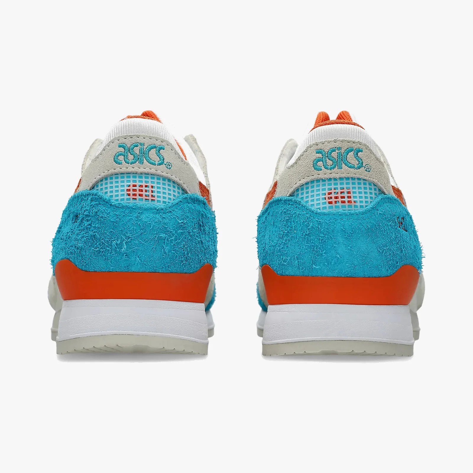 Pair of ASICS sneakers with blue suede heel, orange accents, white midsole, and teal logo on gray suede heel tab.