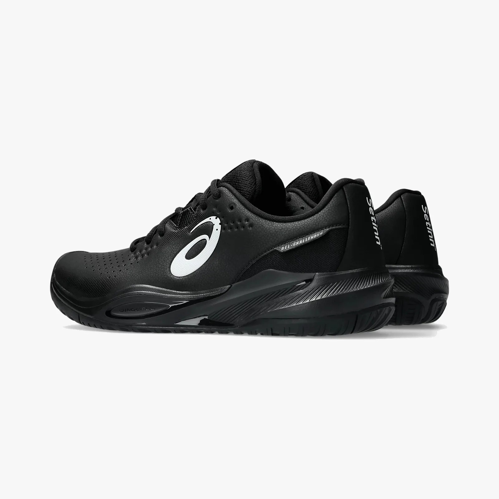 Pair of black ASICS Gel-Challenger tennis shoes with white logo and textured sole.