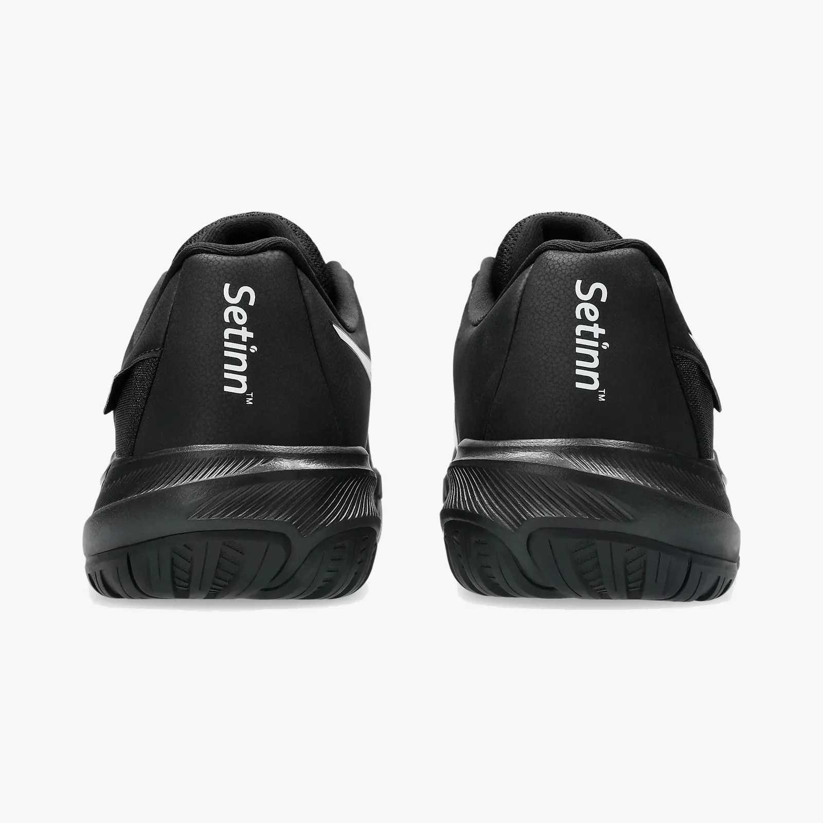 Pair of black athletic shoes with textured soles and "Setinn" branding on the heel counters.
