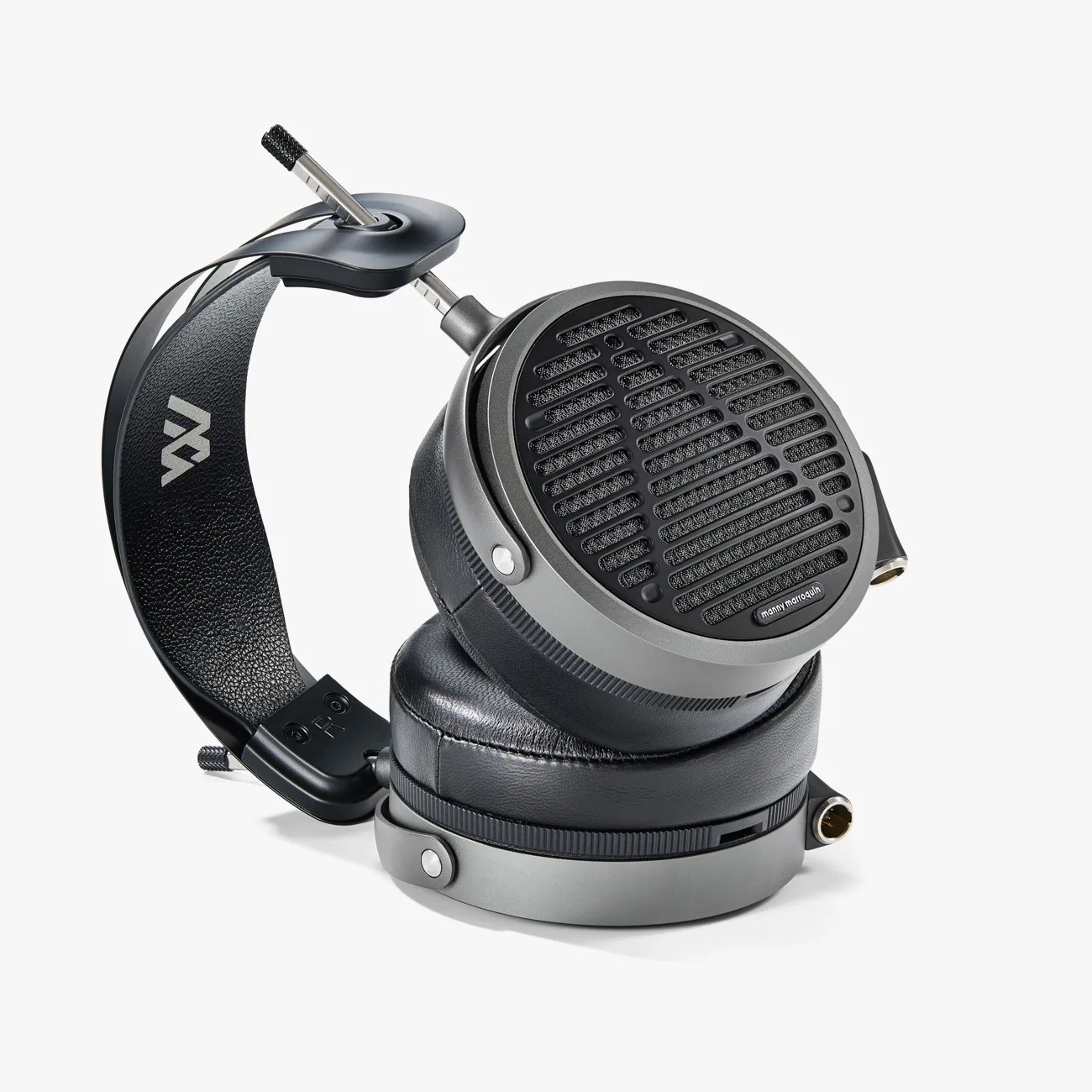 Over-ear open-back headphones with black leather ear pads and a metal headband featuring a logo.
