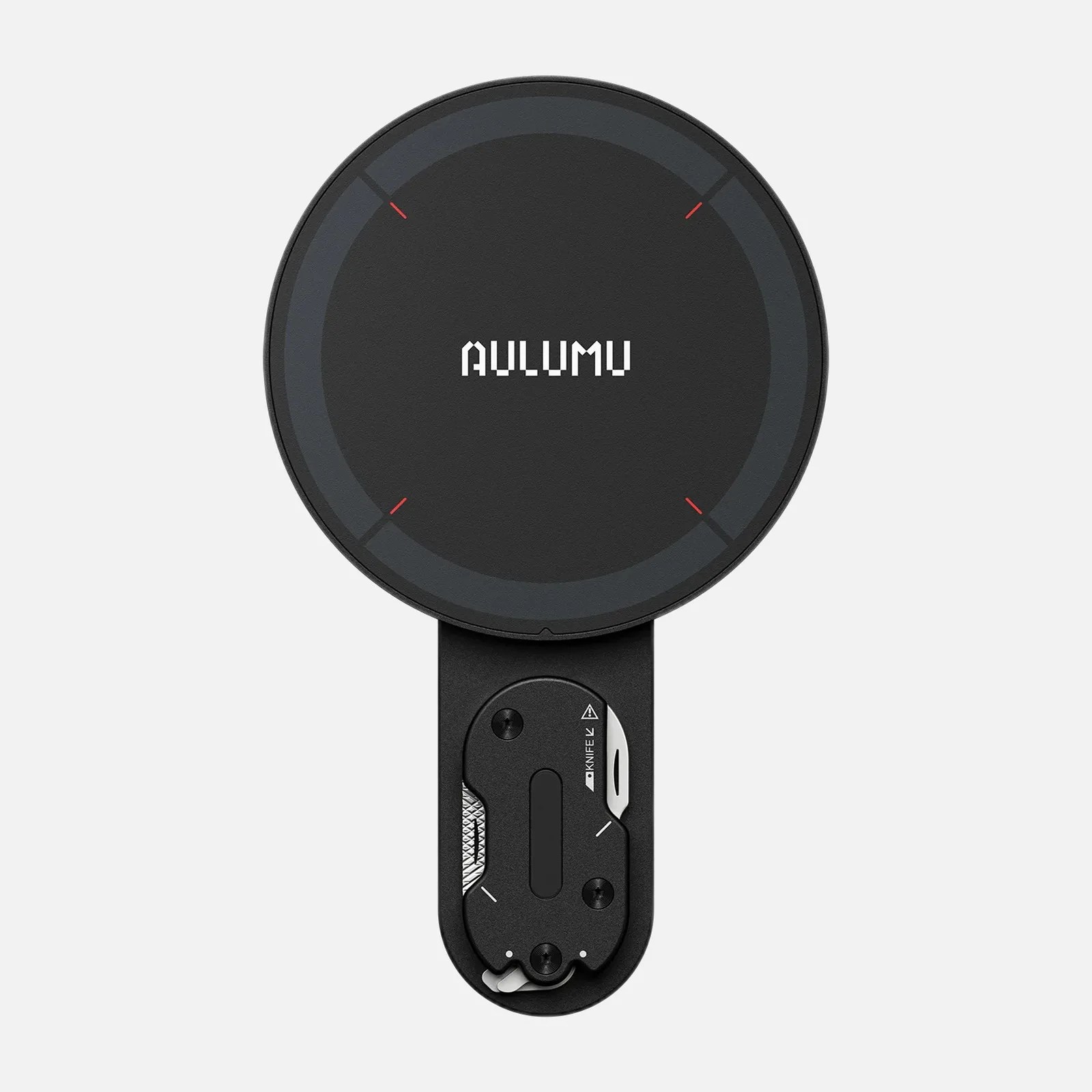 Black circular device with "AULUMU" text on top and a built-in small knife and tool compartment below.