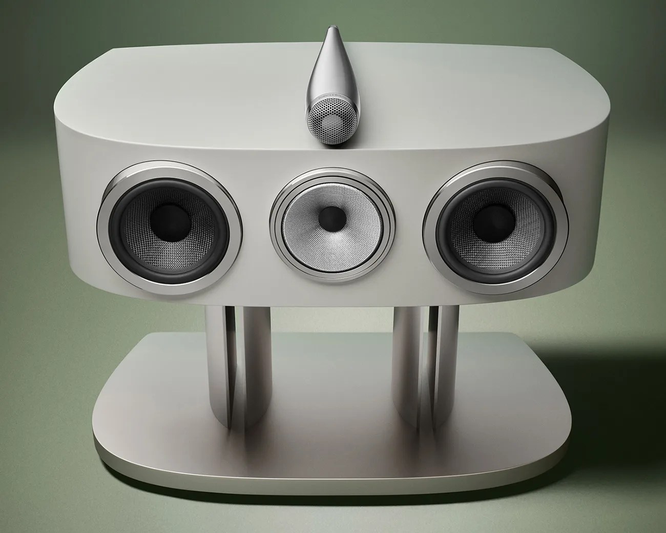 Silver high-end speaker system with three circular drivers and a central tweeter on a matching stand.