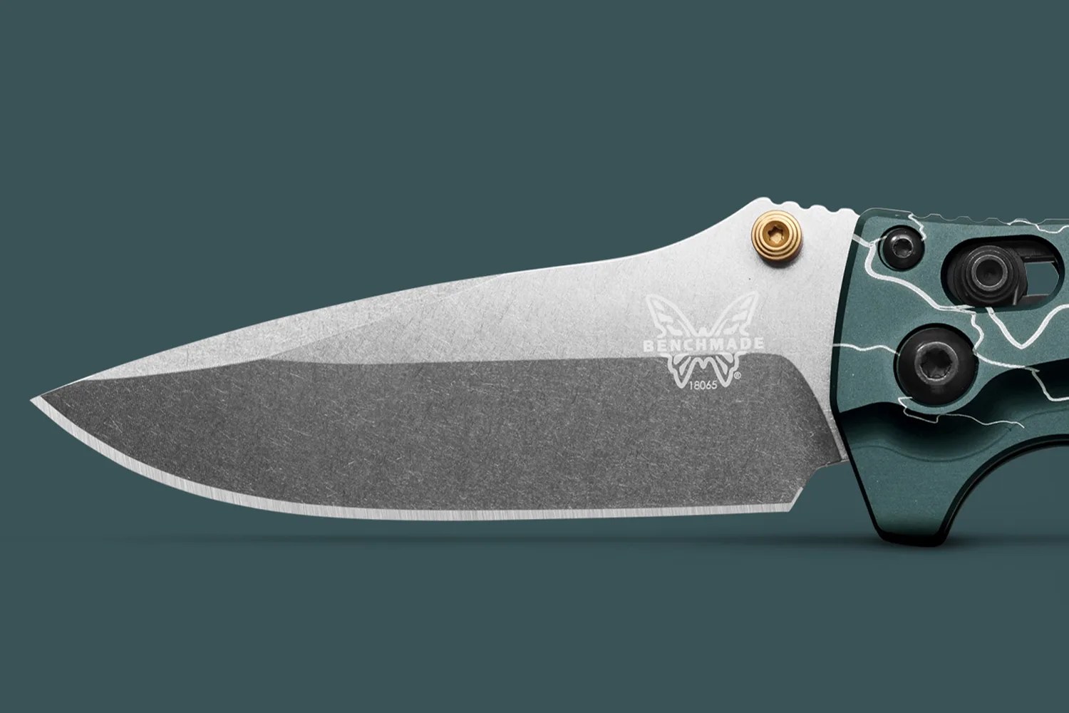 Partially open Benchmade folding knife with a two-tone stonewashed blade and teal handle with white lightning pattern.
