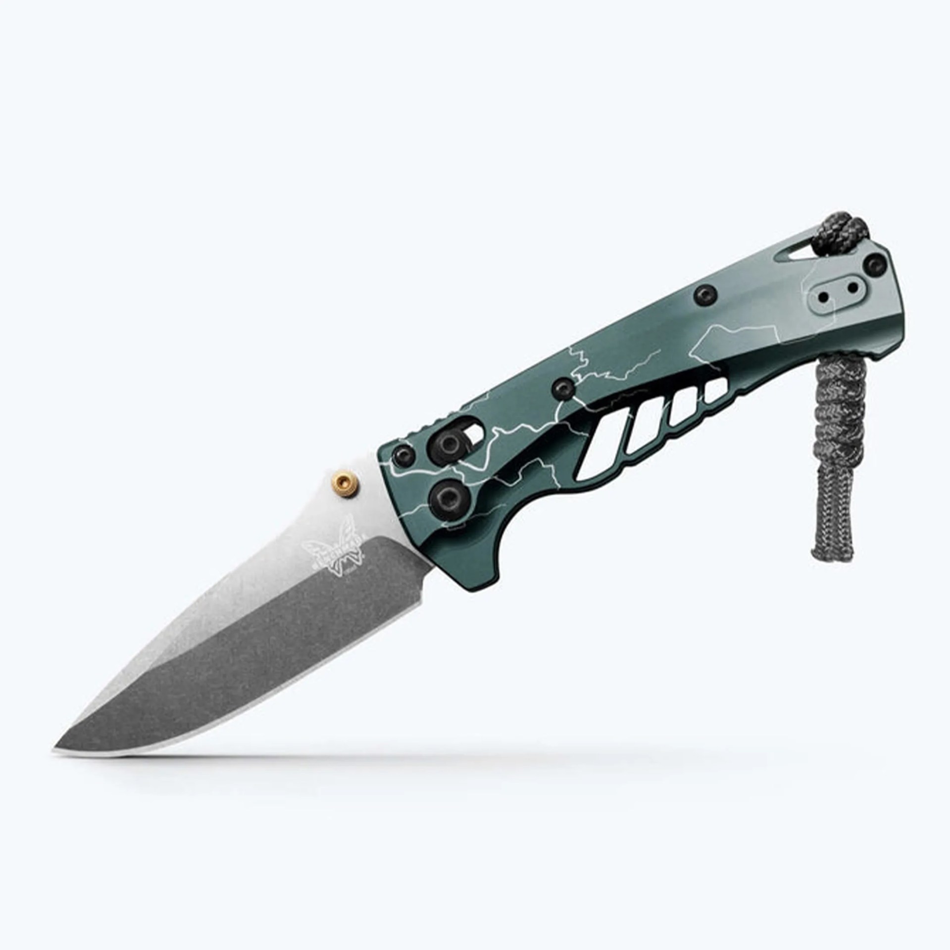 Folding knife with a stonewashed blade and green handle featuring black screws and a paracord lanyard.