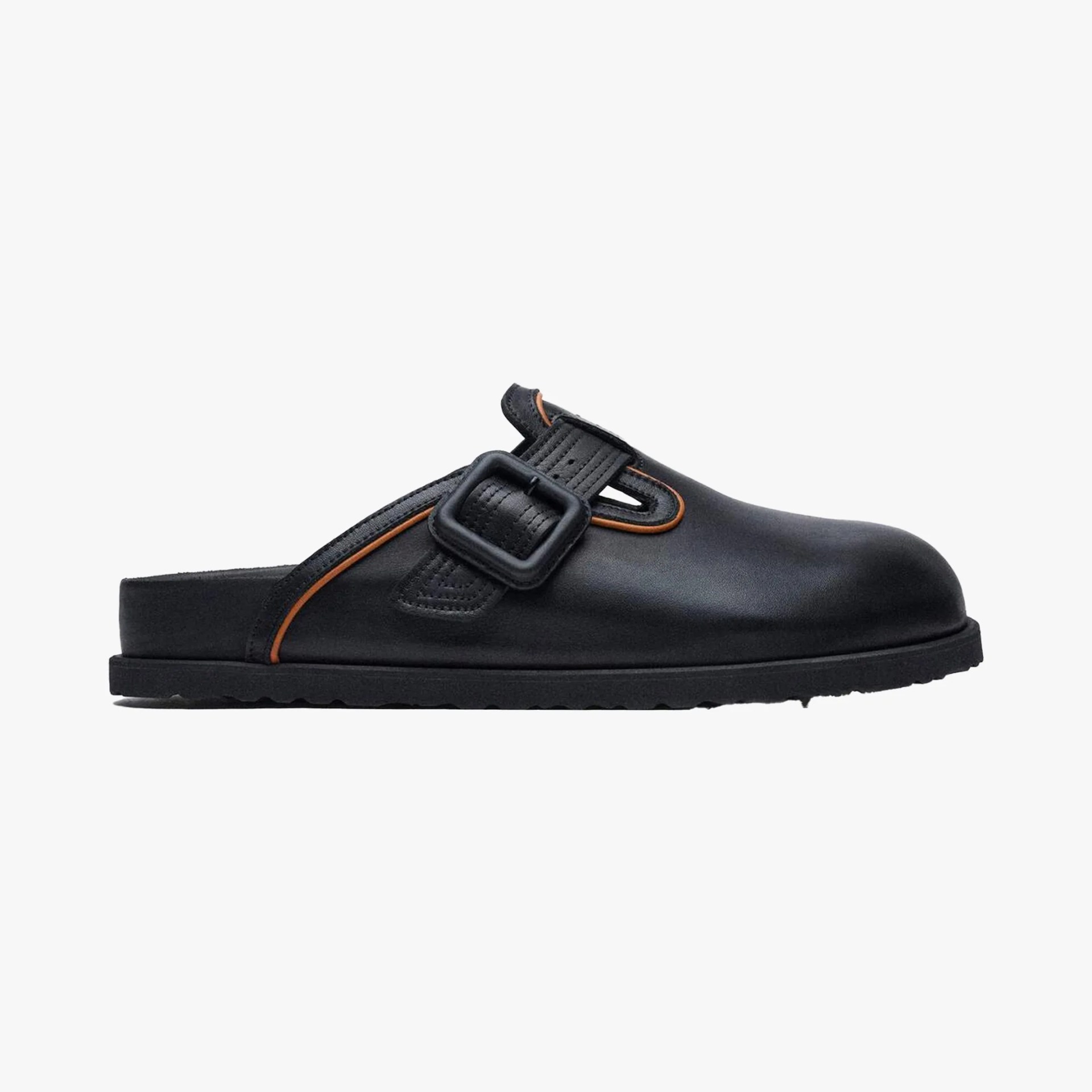 Black leather slip-on clog with a black buckle and orange trim detail.