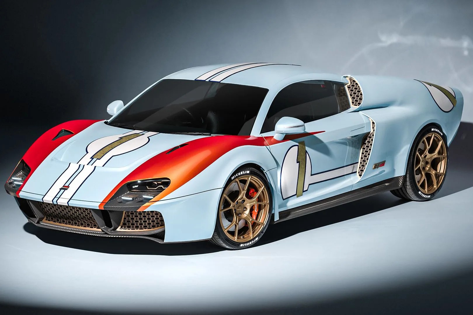 Light blue sports car with red front fenders, gold racing number 1 decals, and bronze wheels.