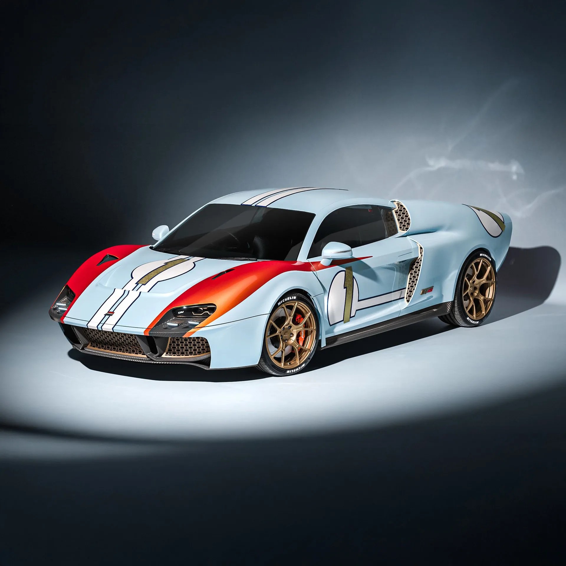 Light blue sports car with red front fenders, gold racing stripes, and bronze wheels on a gray surface.