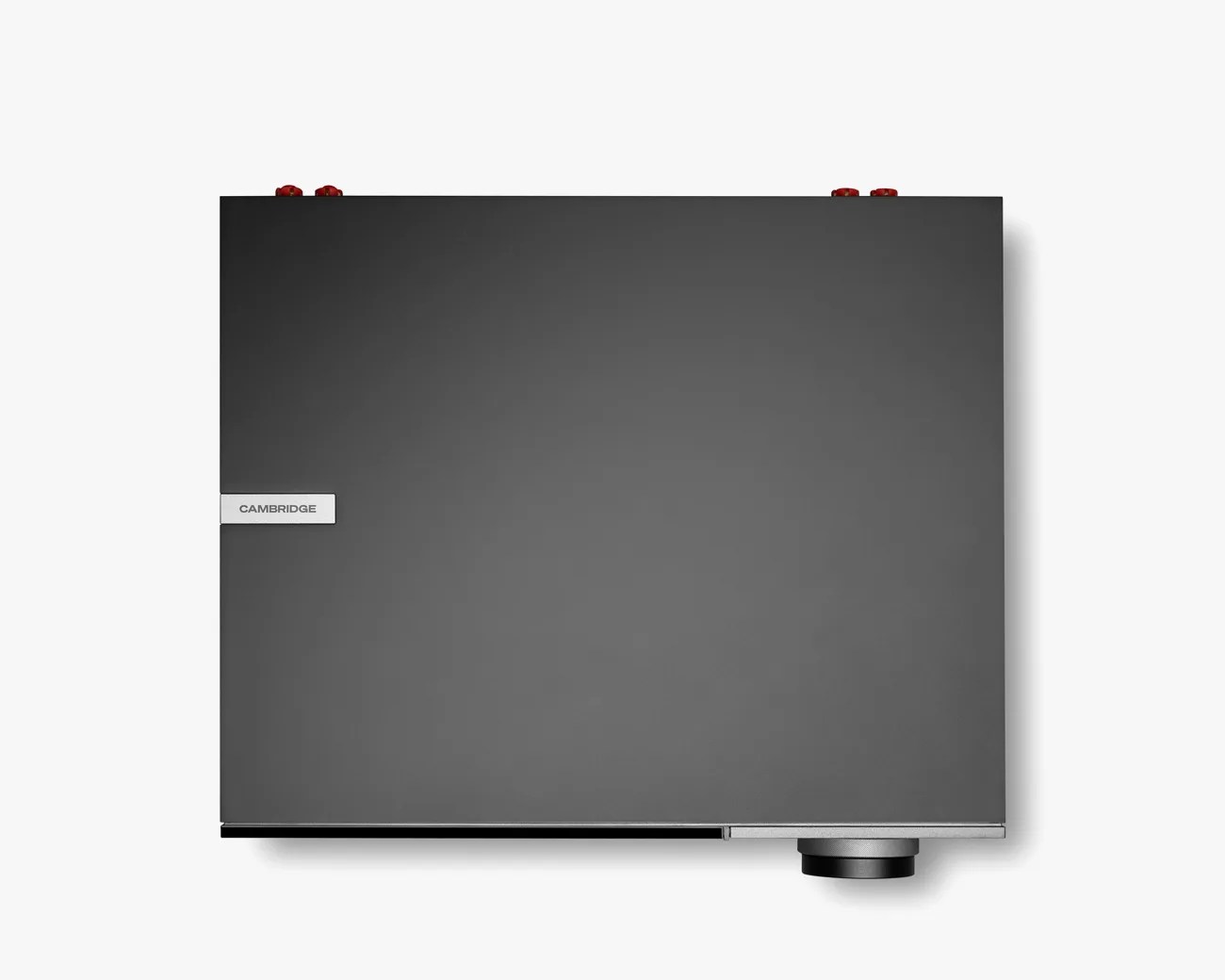 Top view of a black Cambridge audio amplifier with a silver knob on the bottom right and red connectors on the top edges.