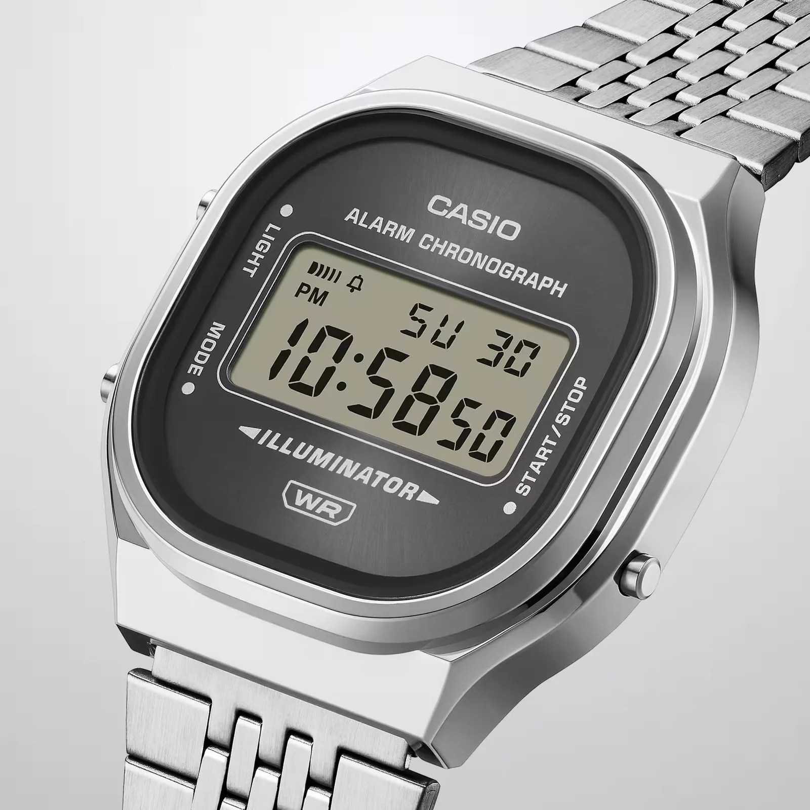 Silver Casio digital watch with black face, alarm chronograph, and metal link band.