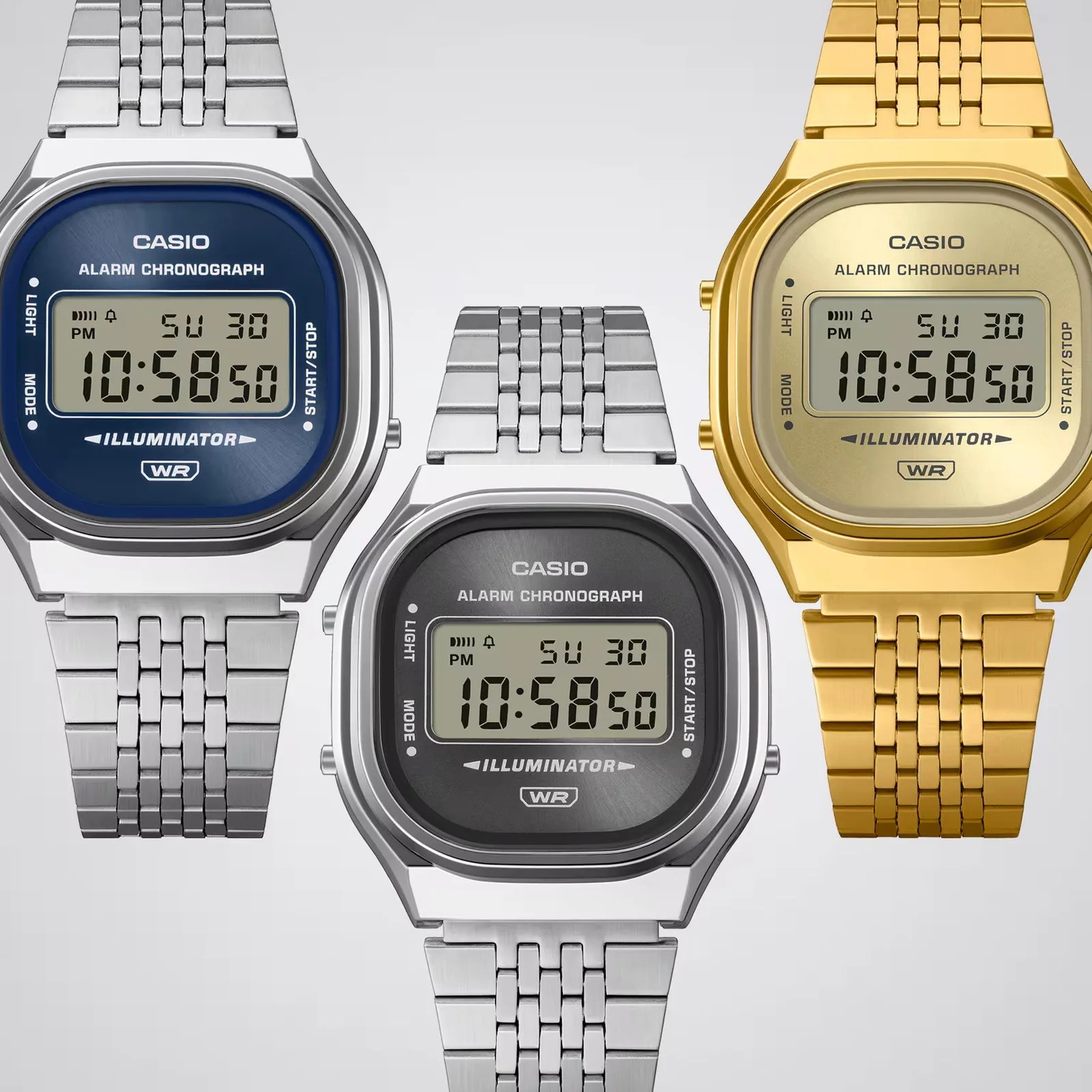 Three Casio digital alarm chronograph watches with metal link bands, one with a blue face, one with a black face, and one with a gold face and band.