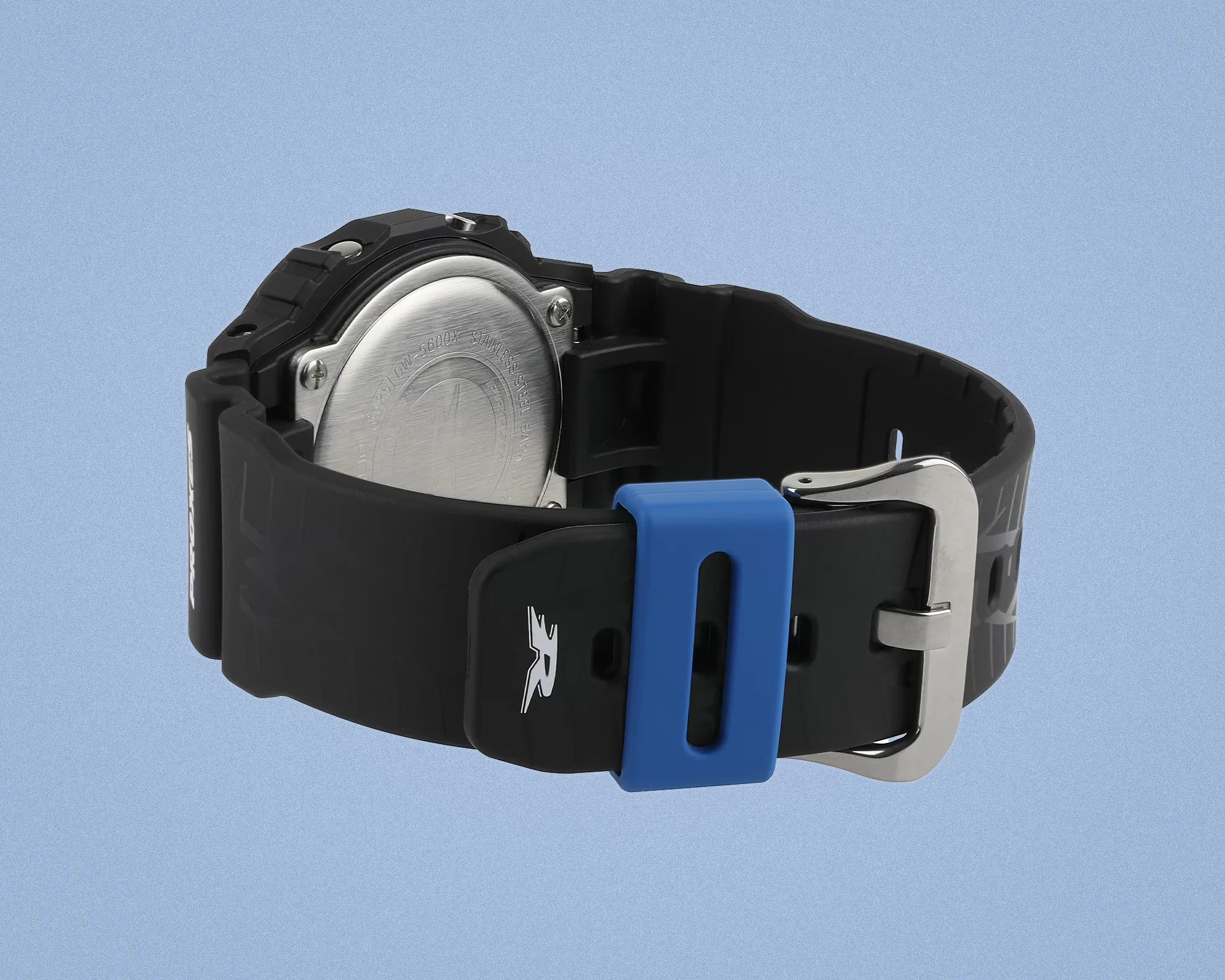Black resin watch strap with a blue loop and silver buckle, showing the stainless steel back of the watch.