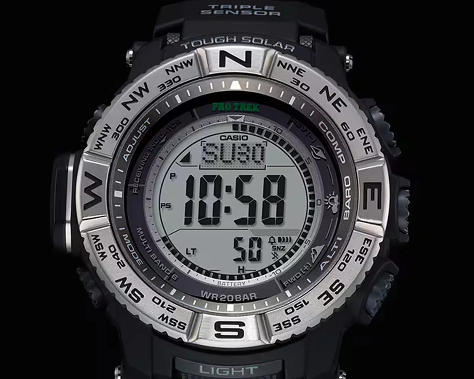 Digital Casio Pro Trek watch with a black and silver bezel showing compass directions and multiple sensor functions.