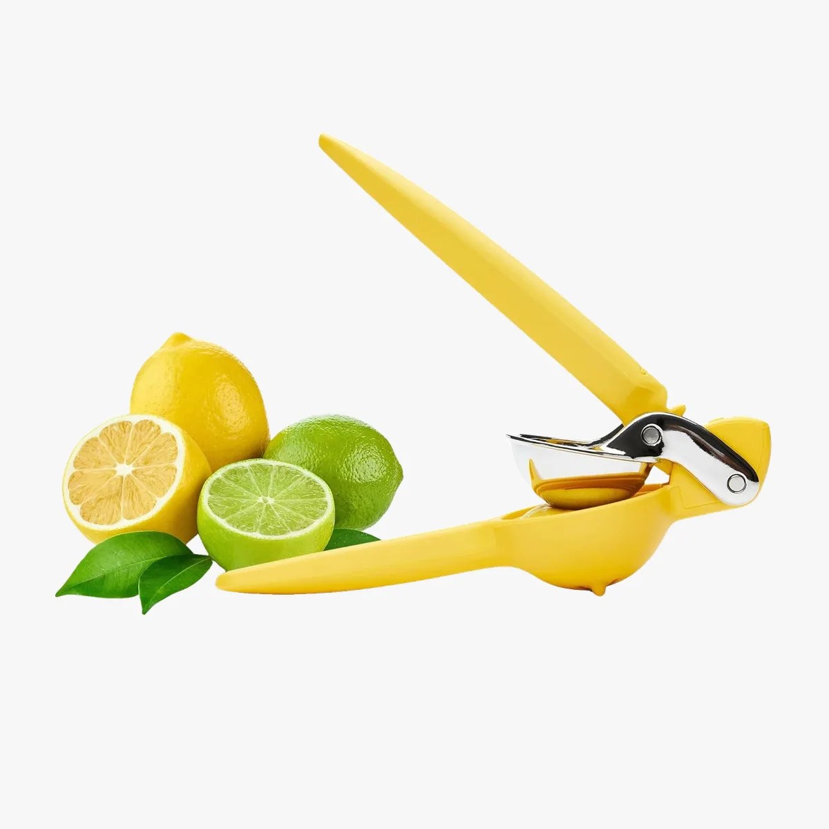 Yellow handheld citrus squeezer with lemons and limes beside it on a white background.