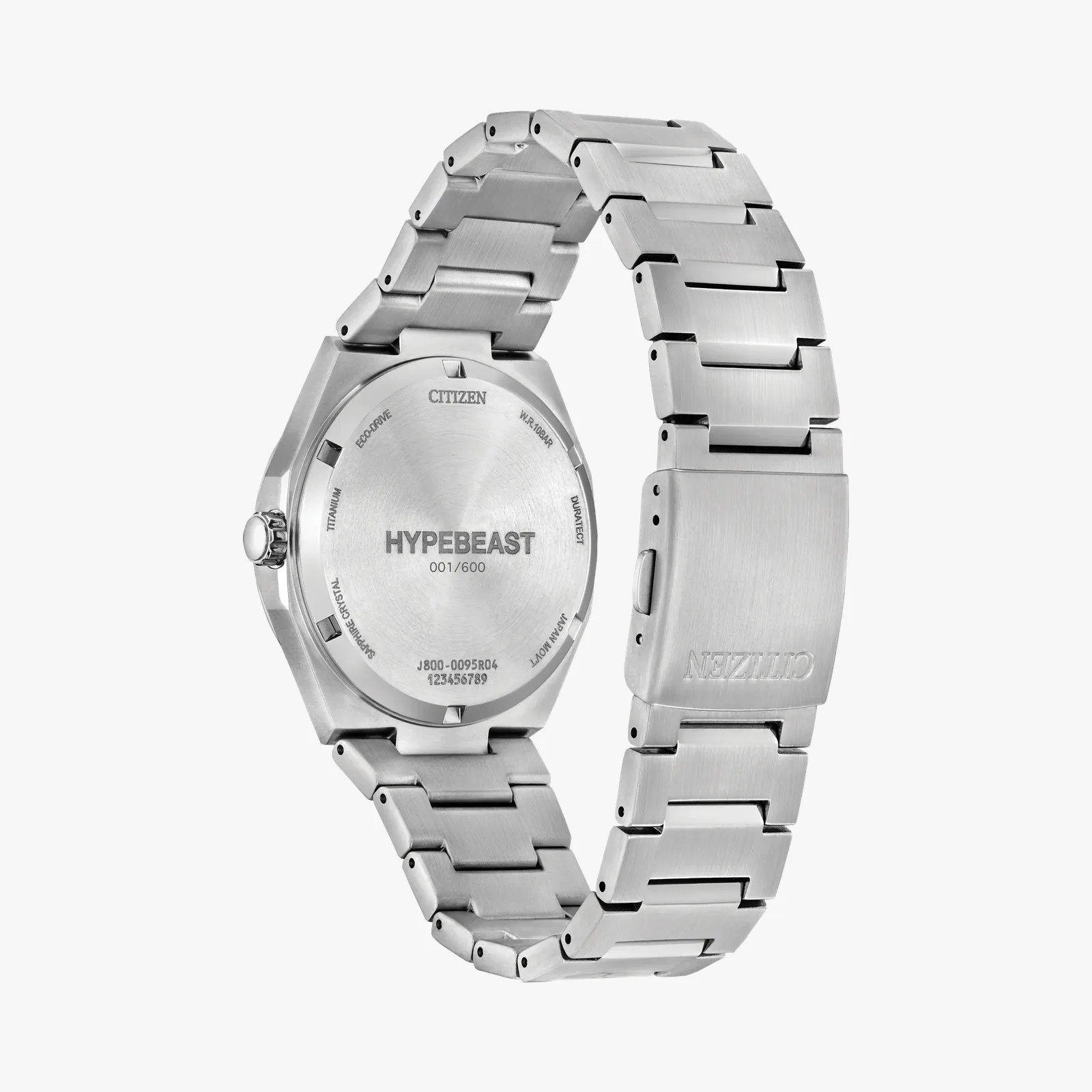 Brushed silver titanium Citizen watch back with "HYPEBEAST 001/600" engraving and linked metal bracelet.