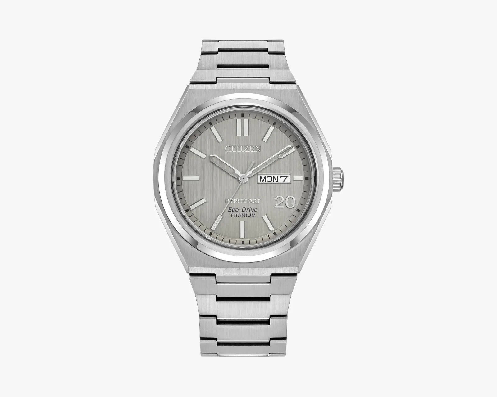 Silver Citizen Eco-Drive titanium wristwatch with day-date display and brushed metal bracelet.