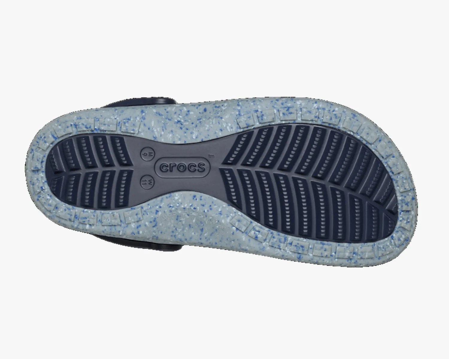 Sole of a Crocs shoe with navy blue tread and light gray speckled outer edge.