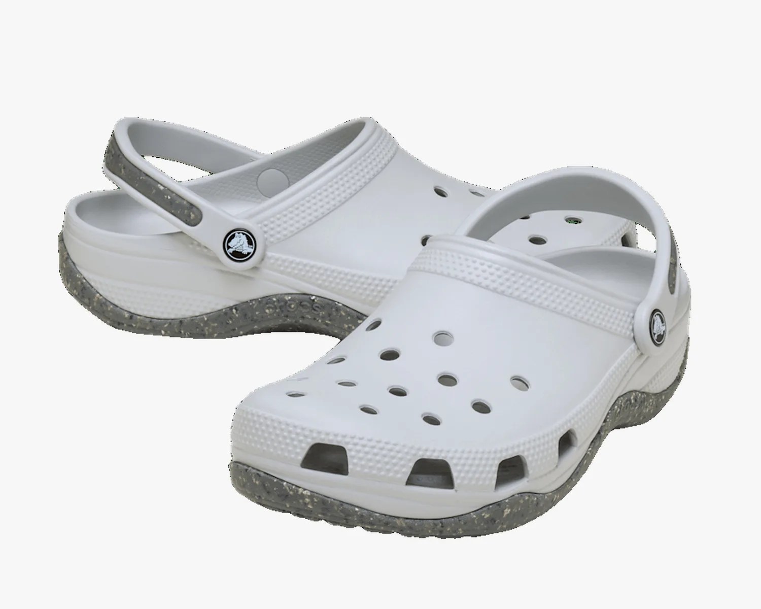 Pair of white Crocs clogs with speckled gray soles and adjustable heel straps.