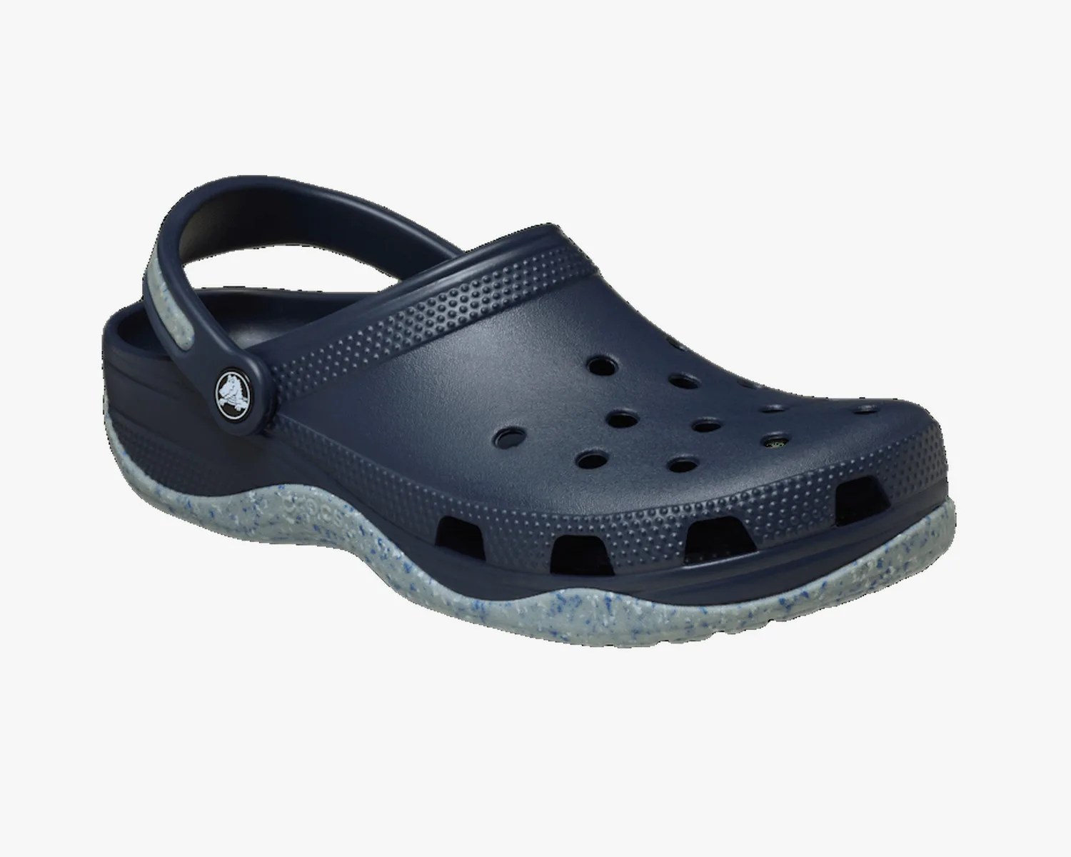 Navy blue Crocs clog with speckled light gray sole and ventilation holes.