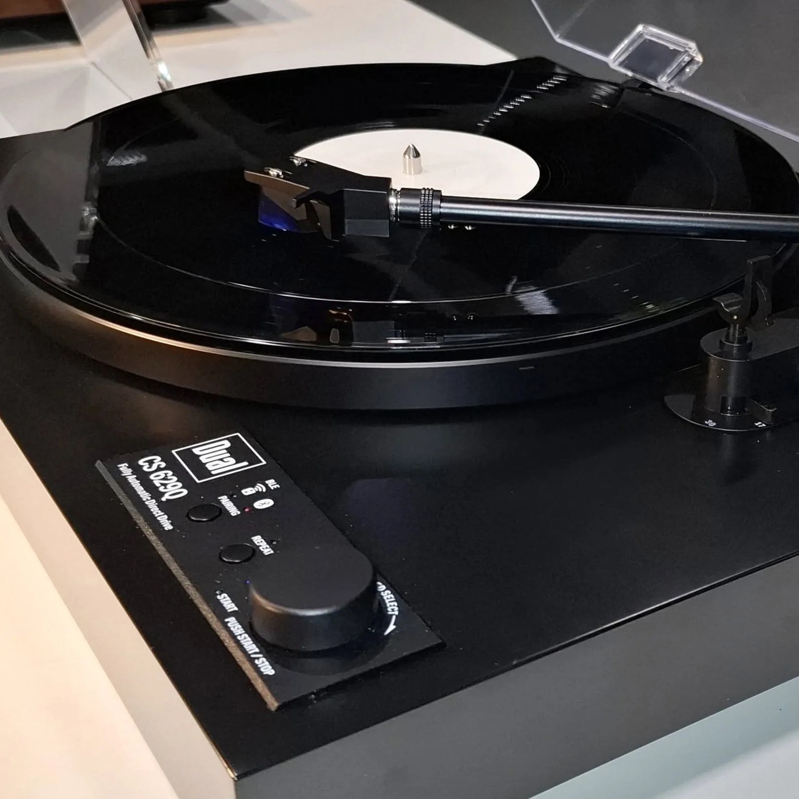 Black Dual CS 629Q fully automatic direct drive turntable with a vinyl record on the platter.