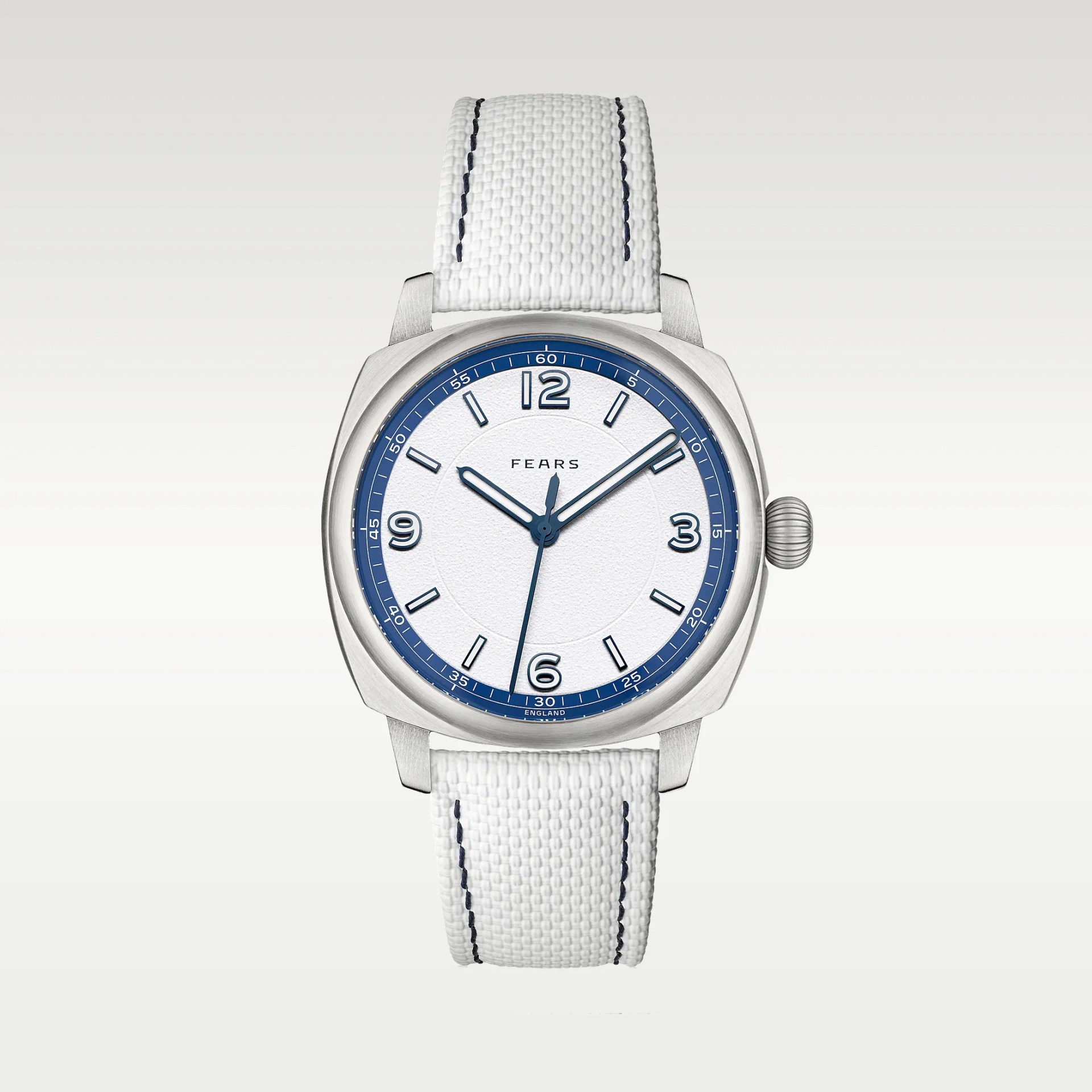 Silver wristwatch with white textured dial, blue numerals and hands, and white fabric strap with dark stitching.