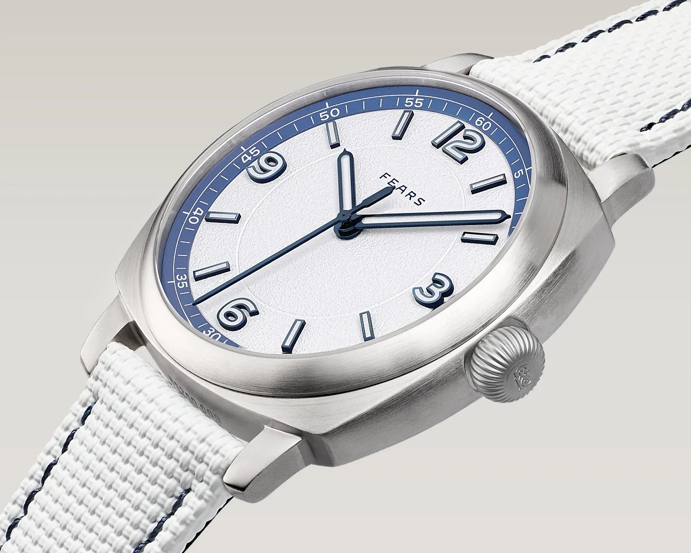 Silver stainless steel wristwatch with white textured dial, blue hour markers, and white woven strap with blue stitching.
