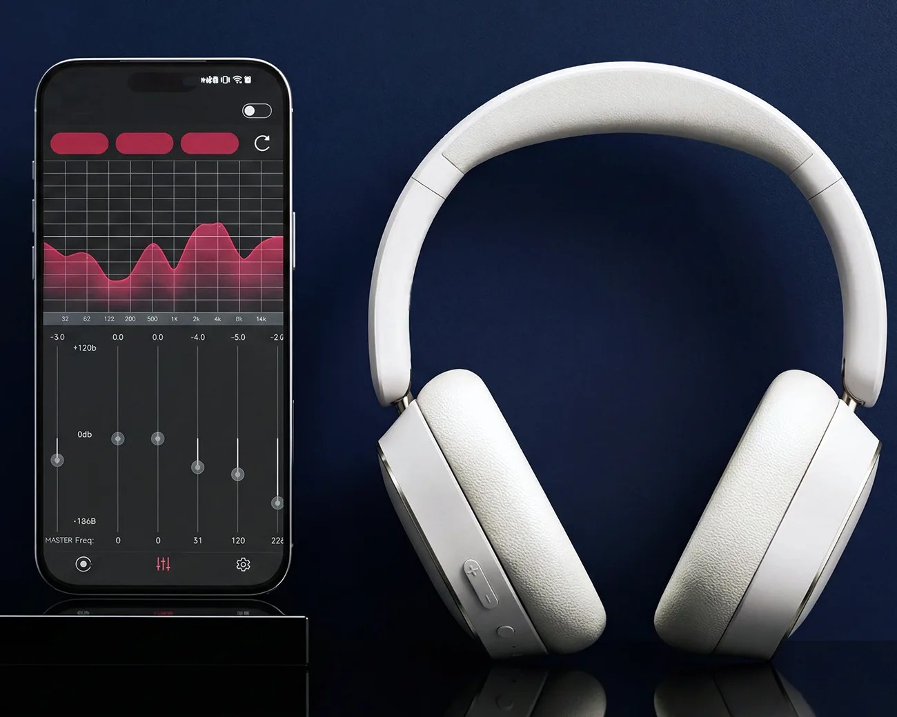 White over-ear wireless headphones next to a smartphone displaying an audio equalizer app on a dark blue background.