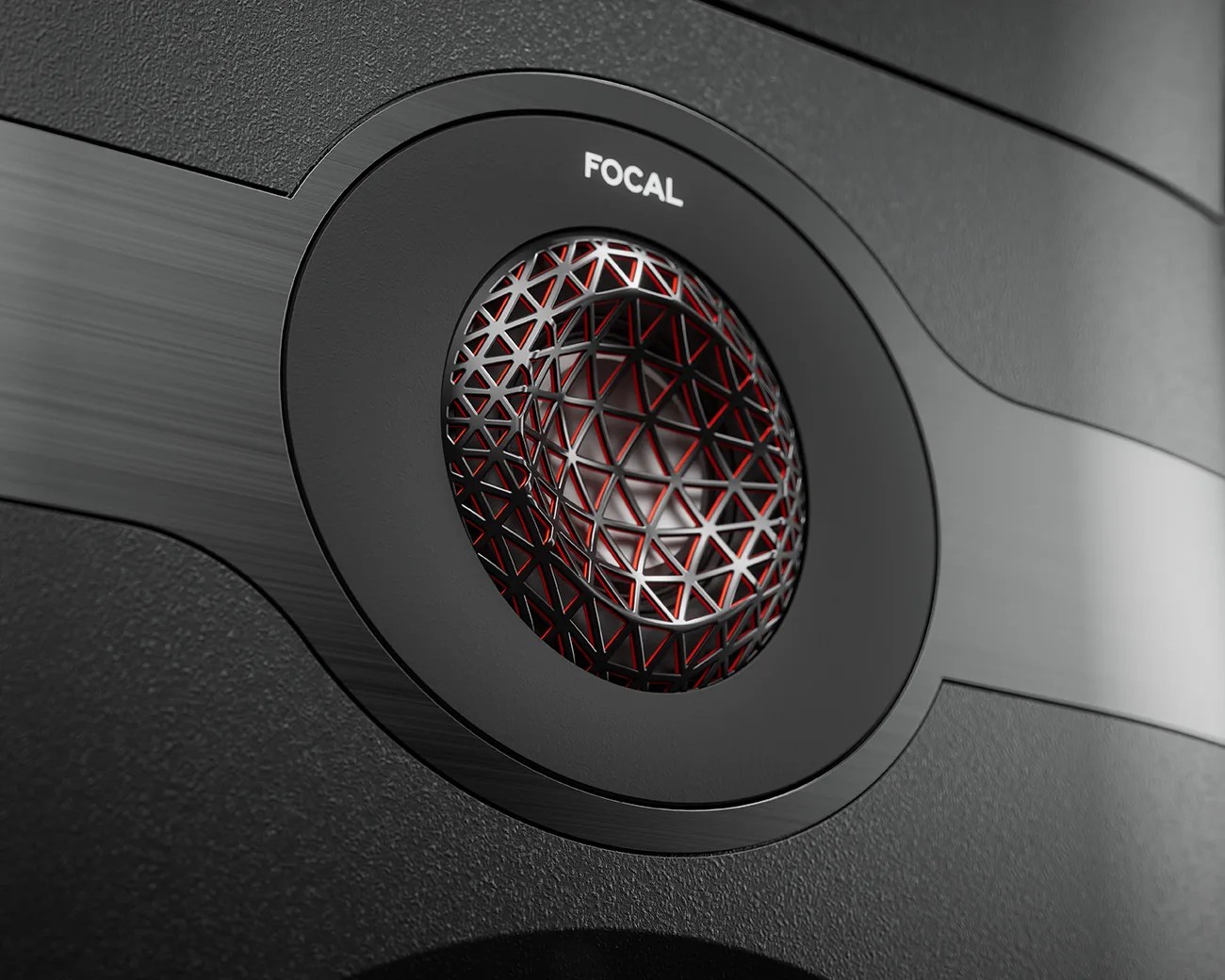 Close-up of a black Focal speaker tweeter with a geometric metal grille and red accents.