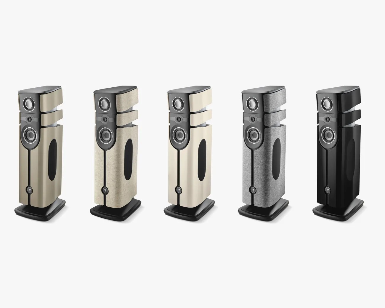 Five tall floor-standing speakers in different finishes including beige, light fabric, cream, gray fabric, and black glossy.