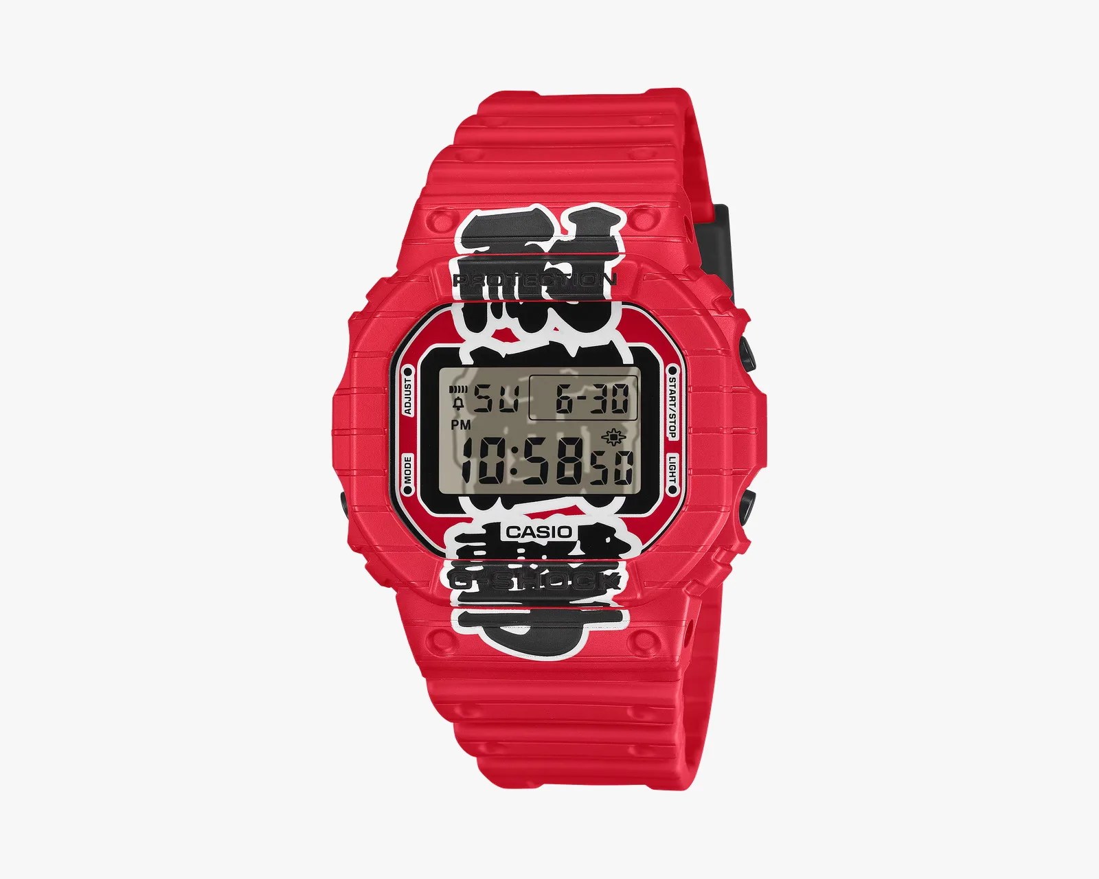 Red Casio G-Shock digital watch with black and white graphic design on the face and strap.