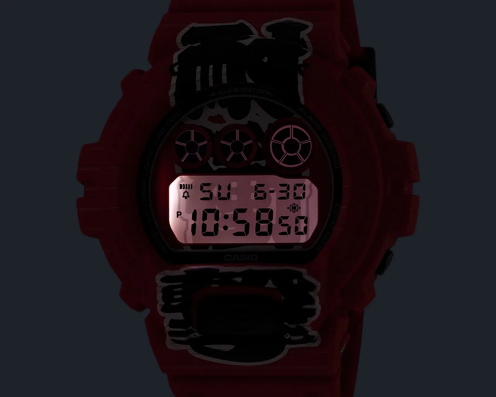Digital Casio watch face illuminated in red backlight showing time 10:58:50 and date Sunday 6-30.