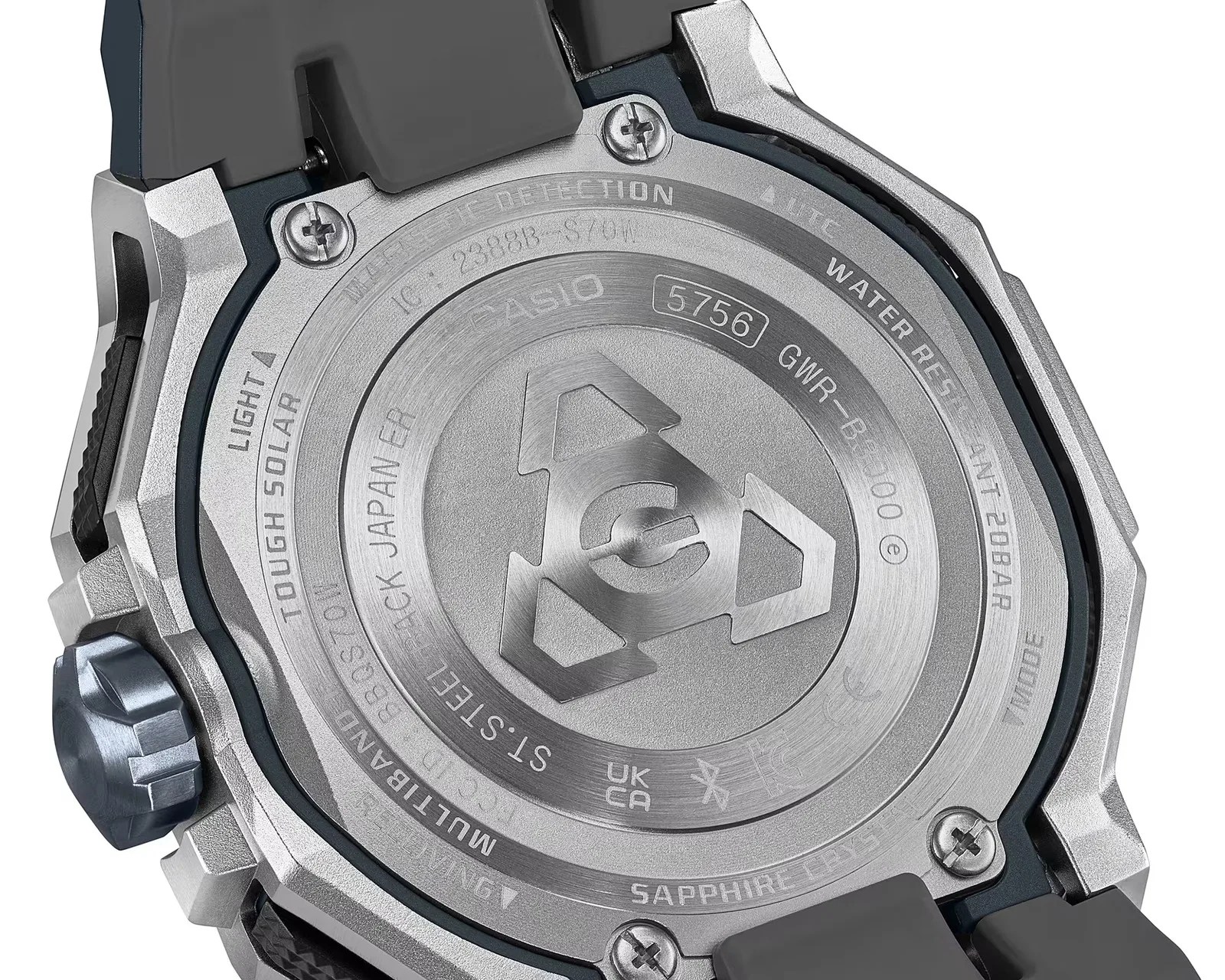 Close-up of the back of a Casio G-Shock watch showing stainless steel case, screws, and engraved technical details.