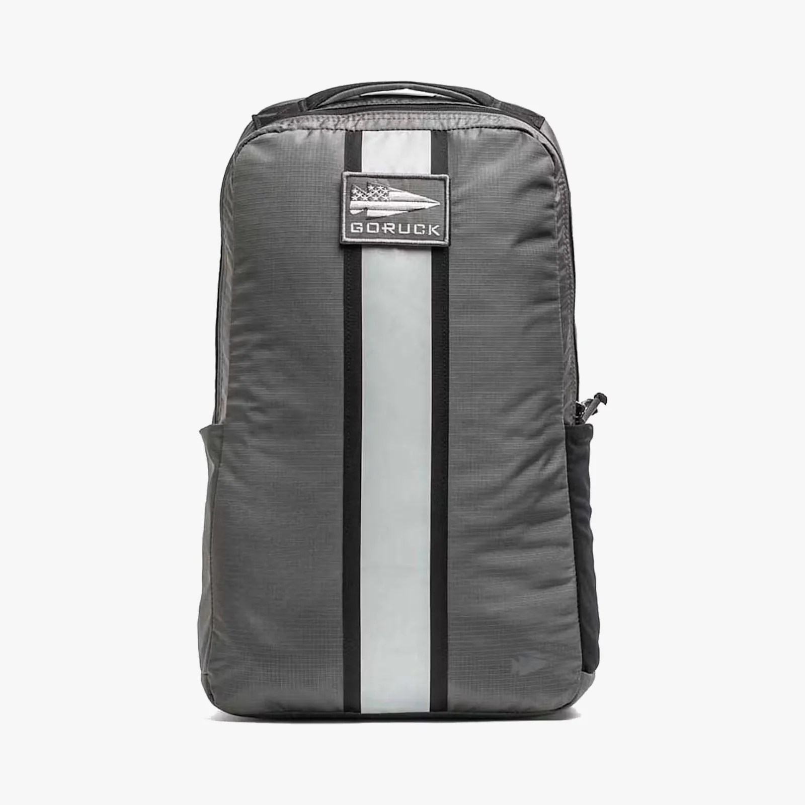 Gray GORUCK backpack with a vertical white and black stripe and a GORUCK logo patch on the front.
