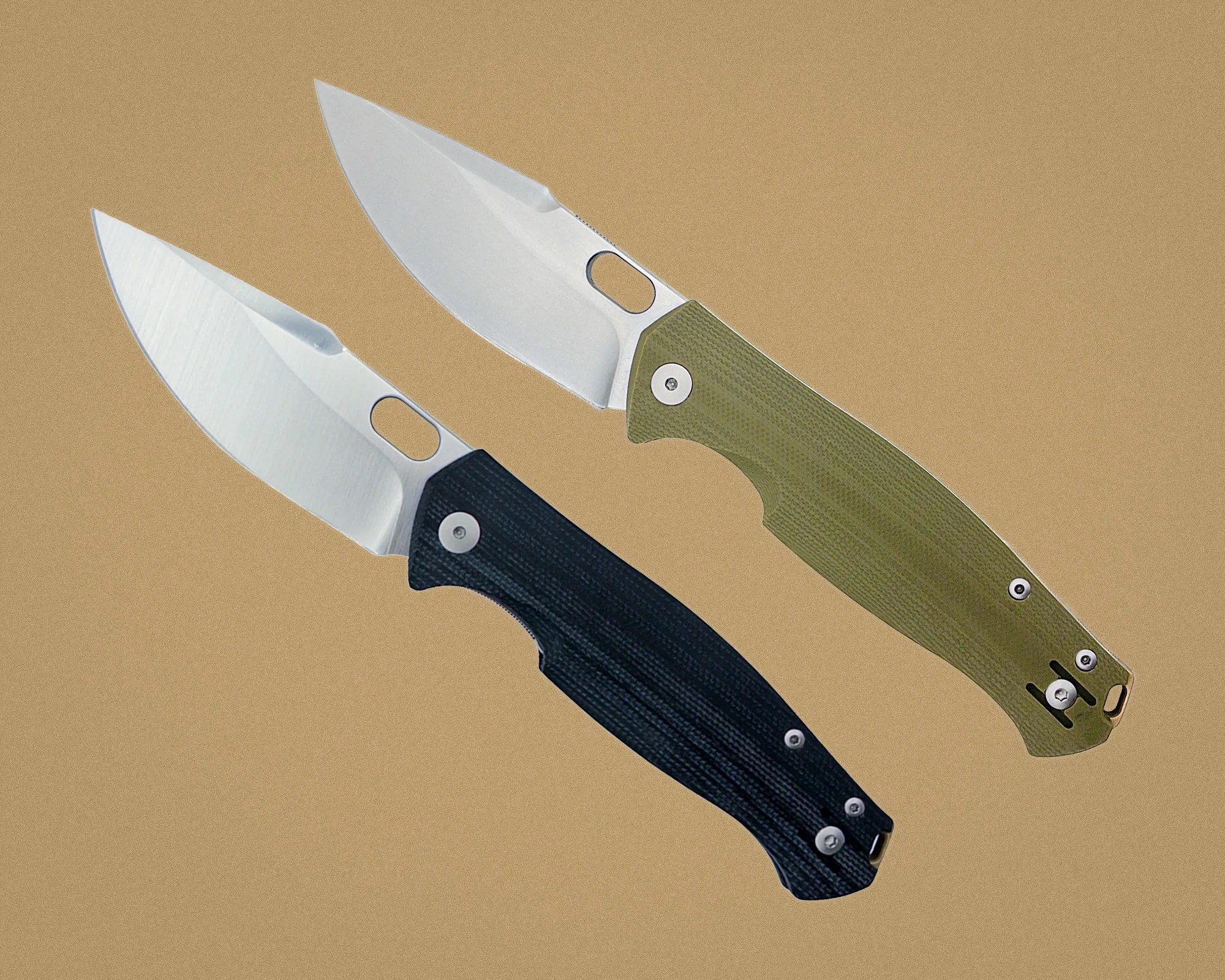 Two folding knives with silver blades, one with a black handle and the other with an olive green handle, on a tan background.