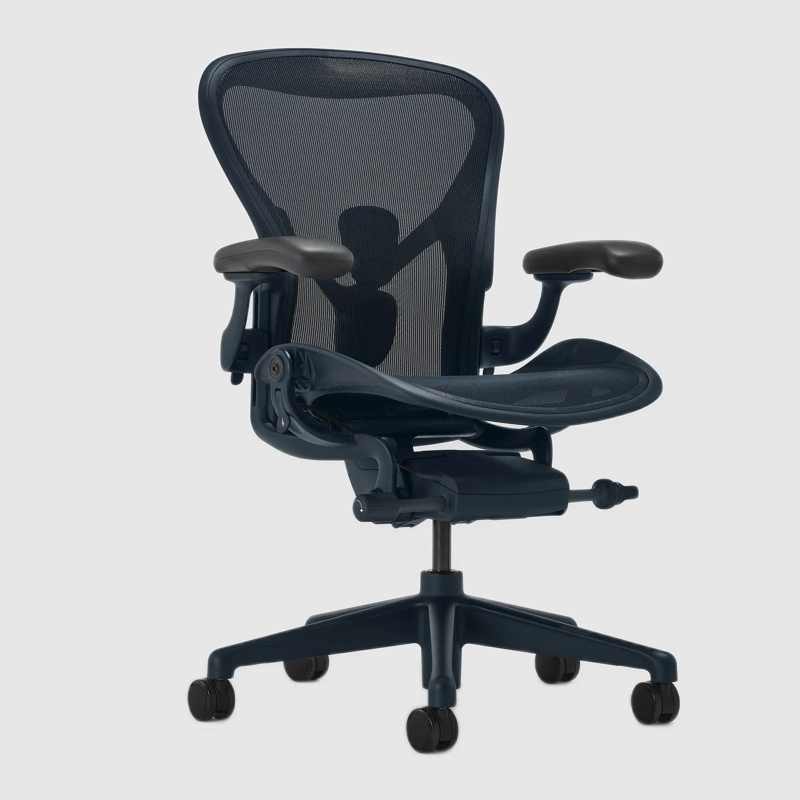 Black ergonomic office chair with mesh backrest, padded armrests, and five caster wheels.