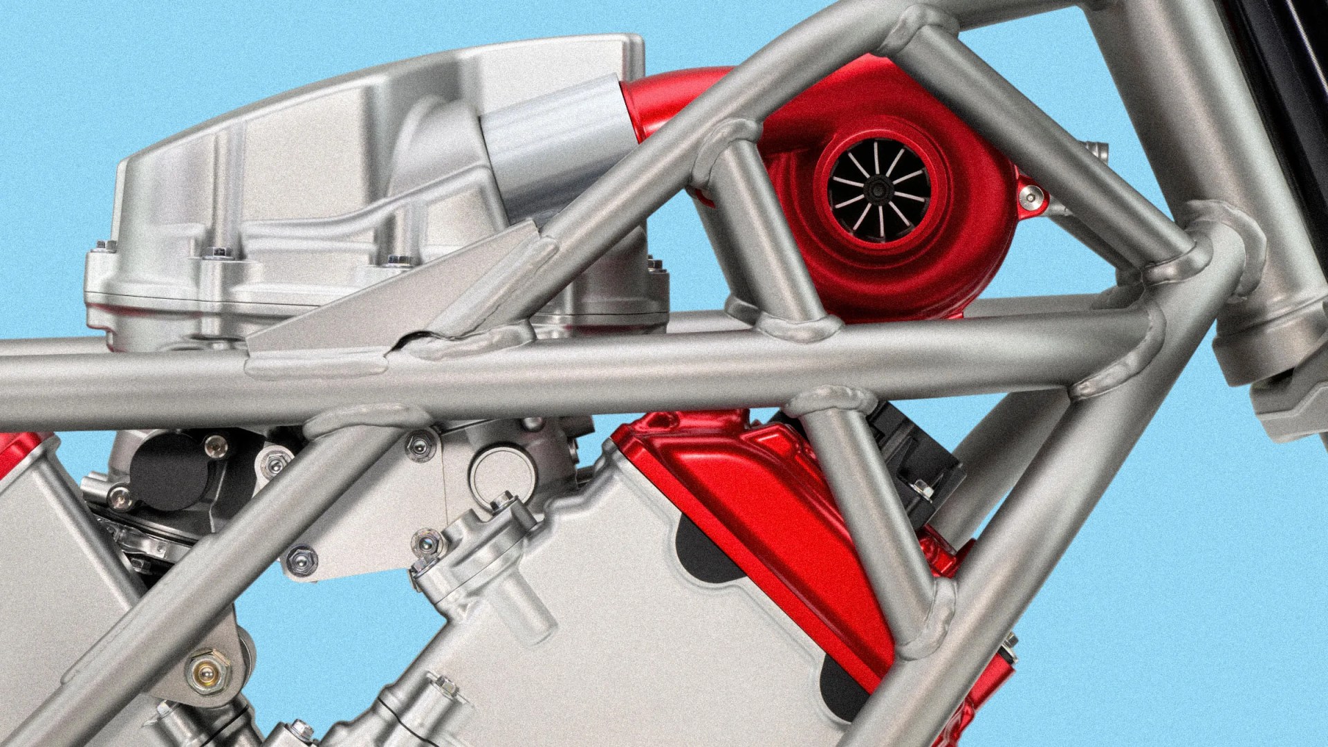 Close-up of a metallic motorcycle frame with a red turbocharger and engine components against a blue background.