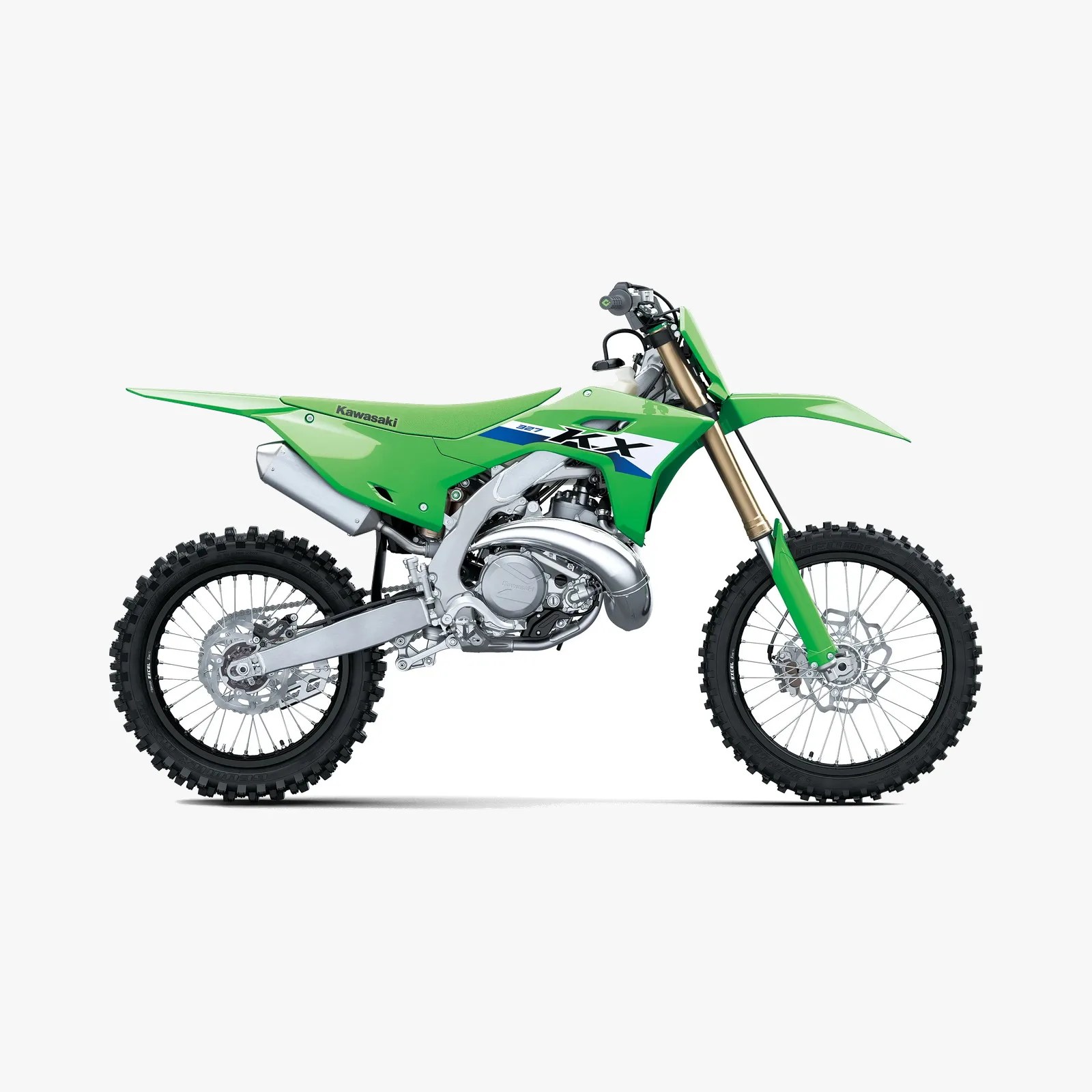 Green Kawasaki KX 327 dirt bike with knobby tires and silver exhaust on a white background.