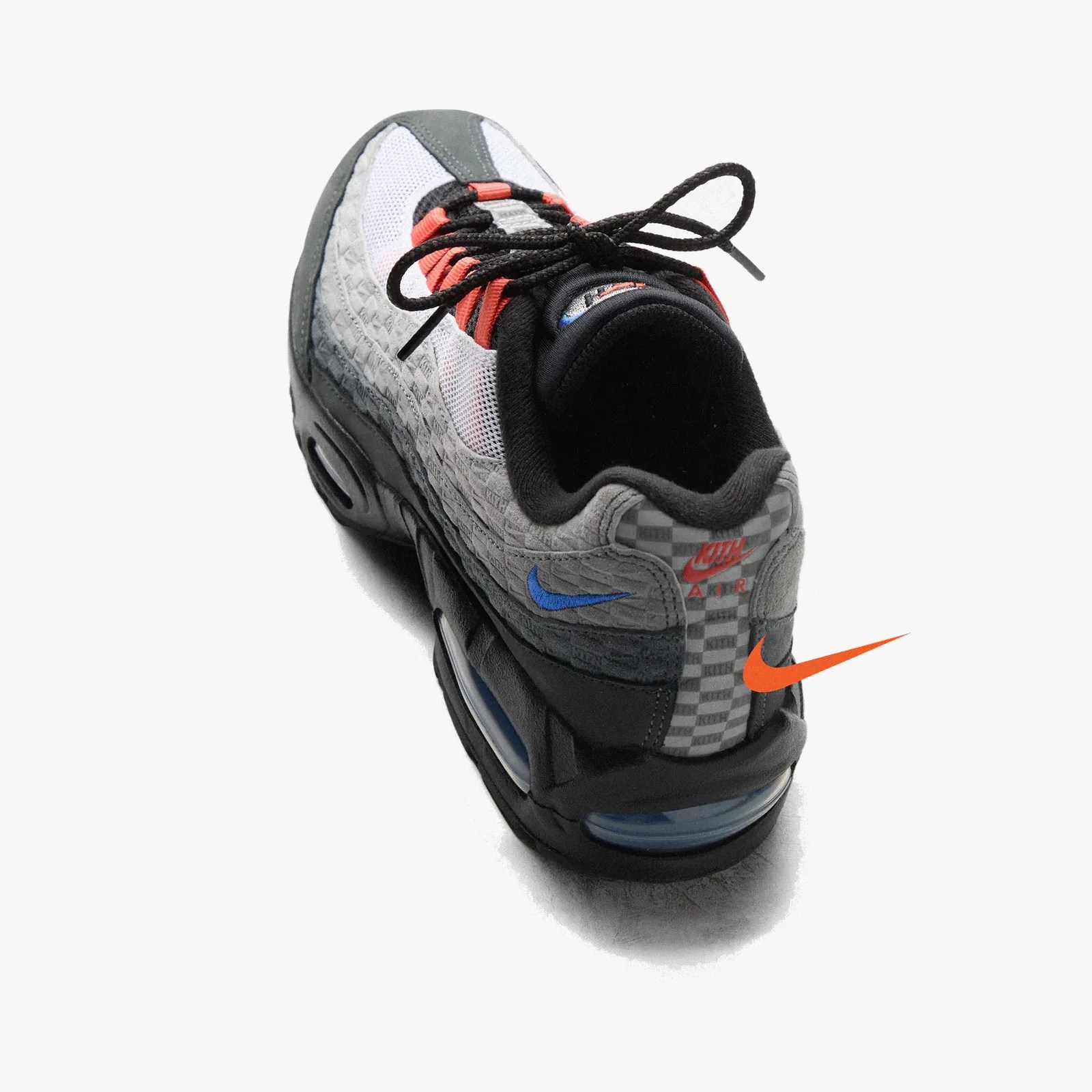 Gray and white Nike Air sneaker with black sole, blue and orange accents, and black laces.