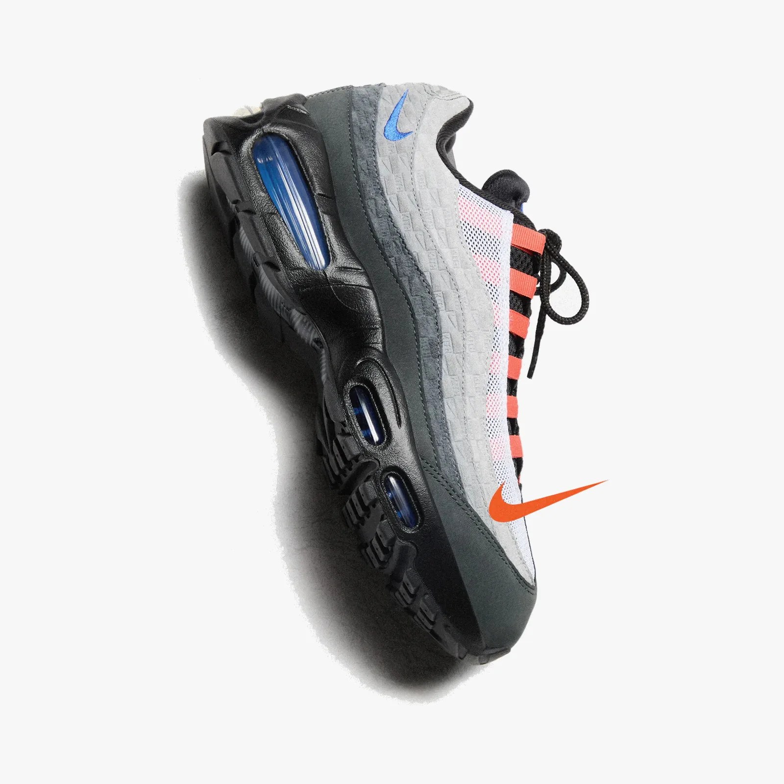 Black, gray, and white Nike Air Max sneaker with blue air cushions and orange accents on a white background.